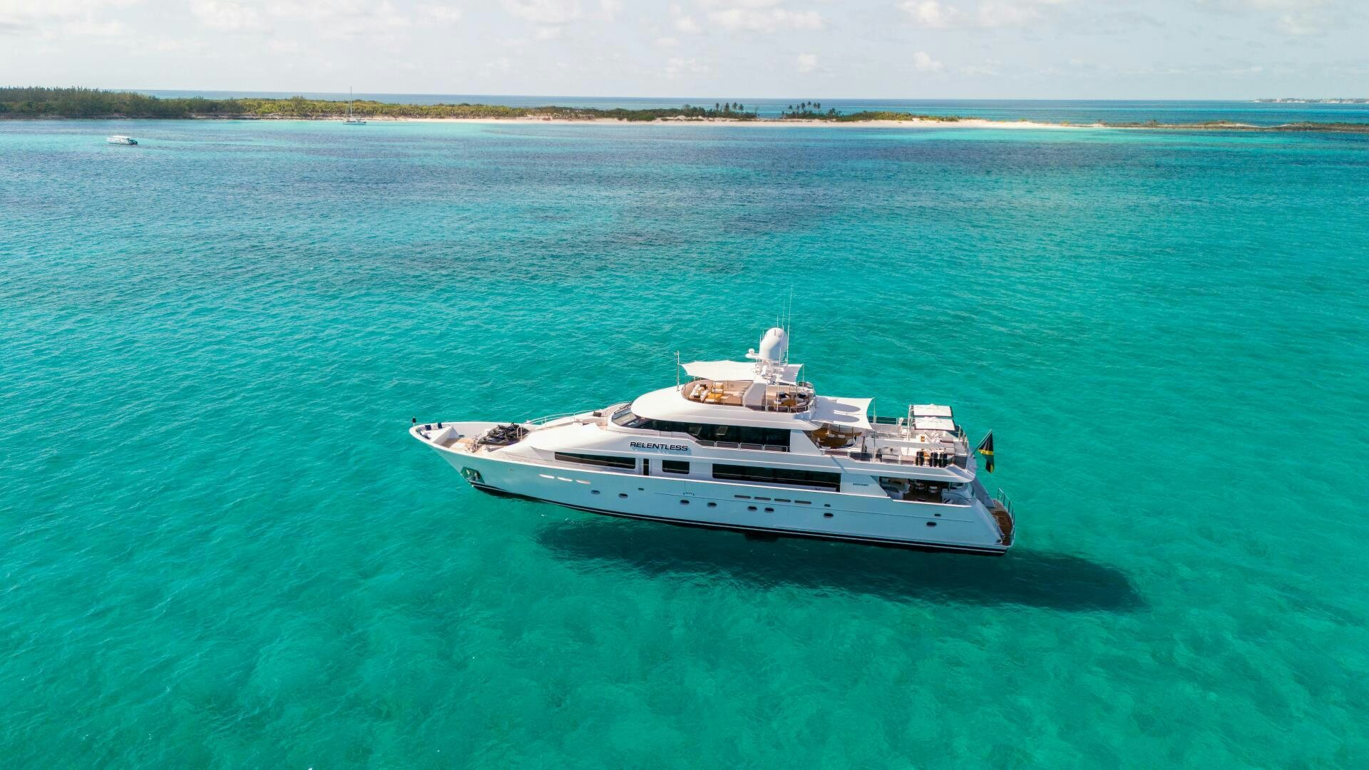 a white boat in the water aboard RELENTLESS Yacht for Sale