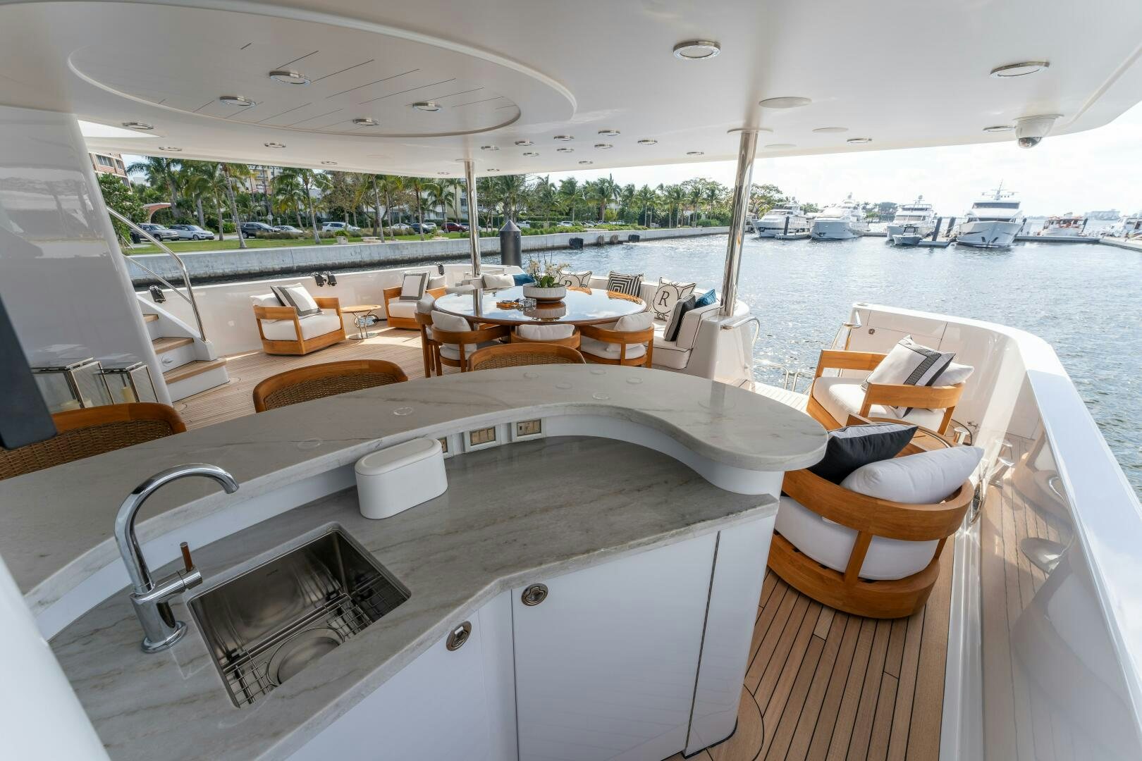 a boat with a table and chairs on the deck aboard RELENTLESS Yacht for Sale