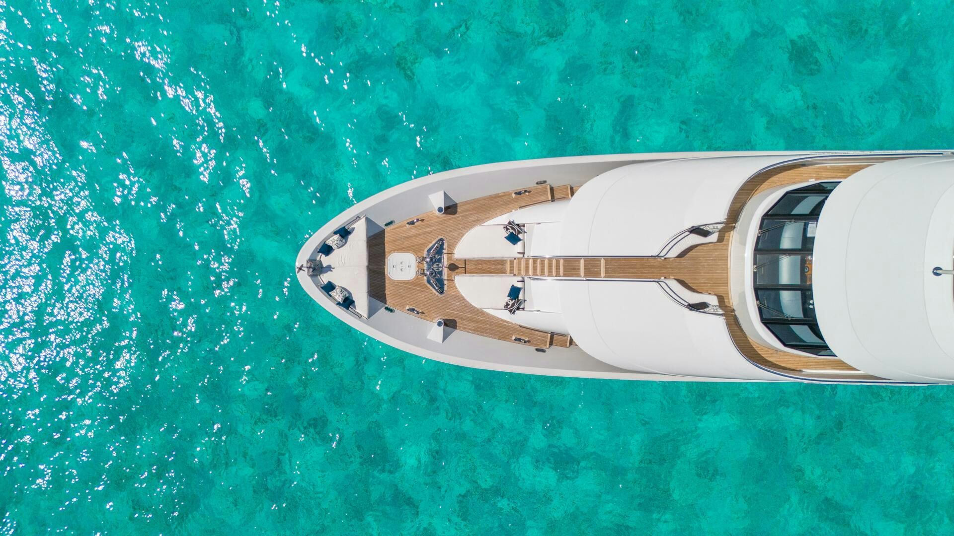 a white and black airplane aboard RELENTLESS Yacht for Sale