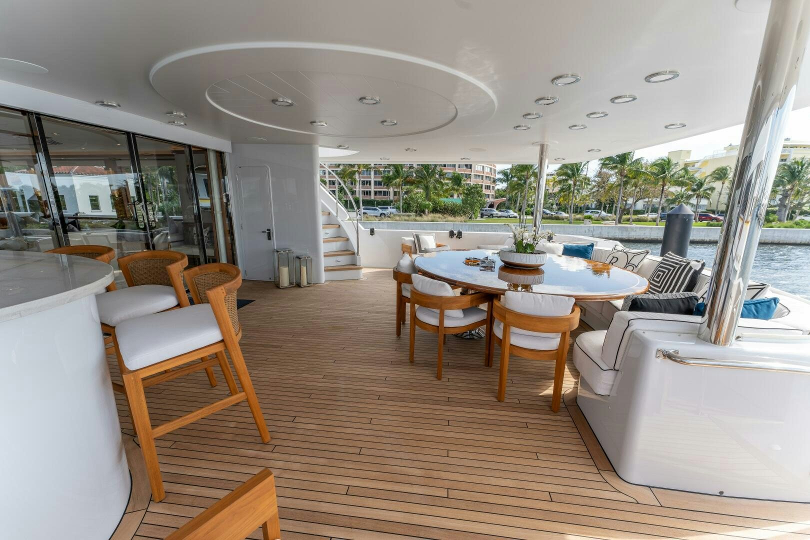 a room with a table chairs and a large window aboard RELENTLESS Yacht for Sale