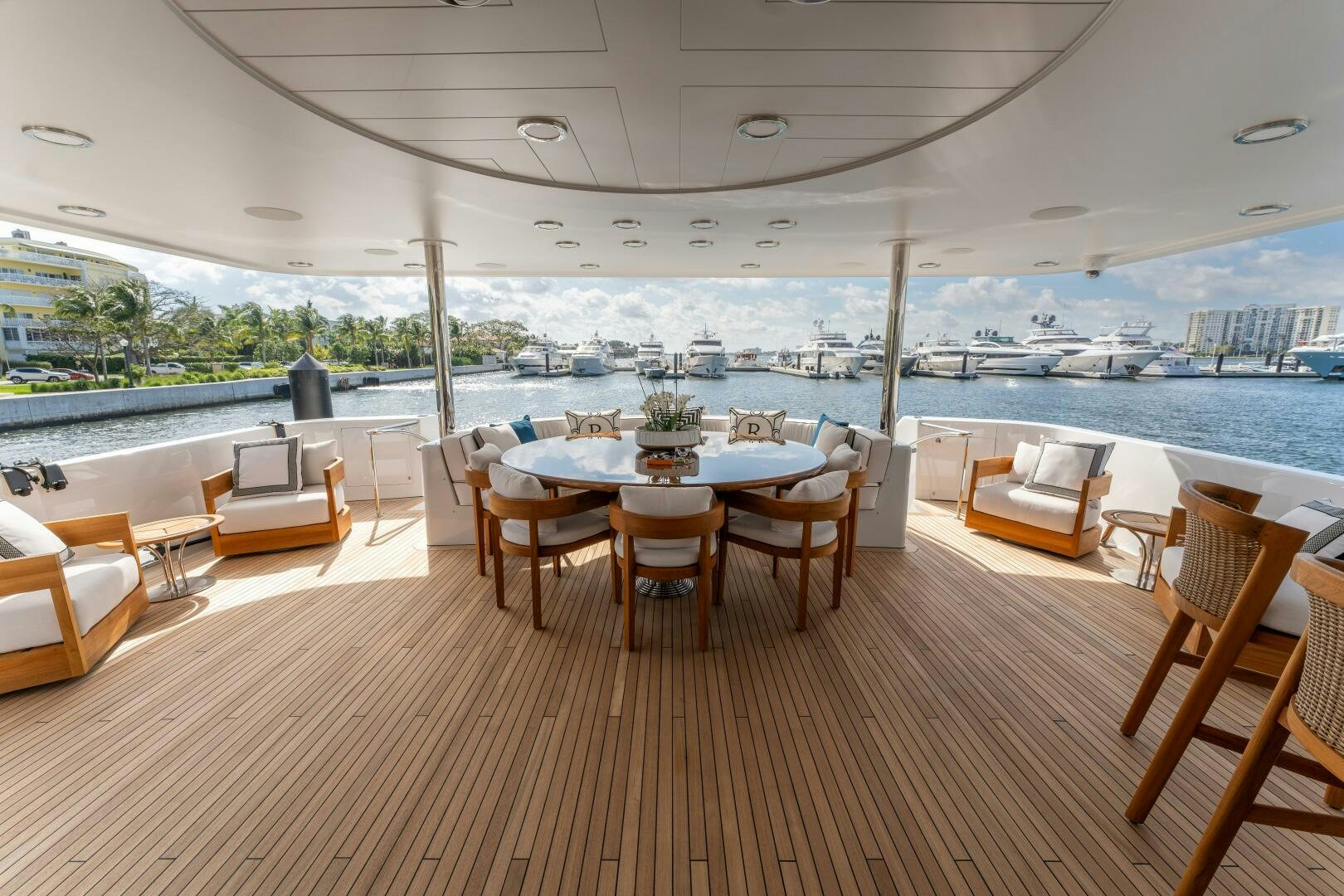 a room with tables and chairs aboard RELENTLESS Yacht for Sale