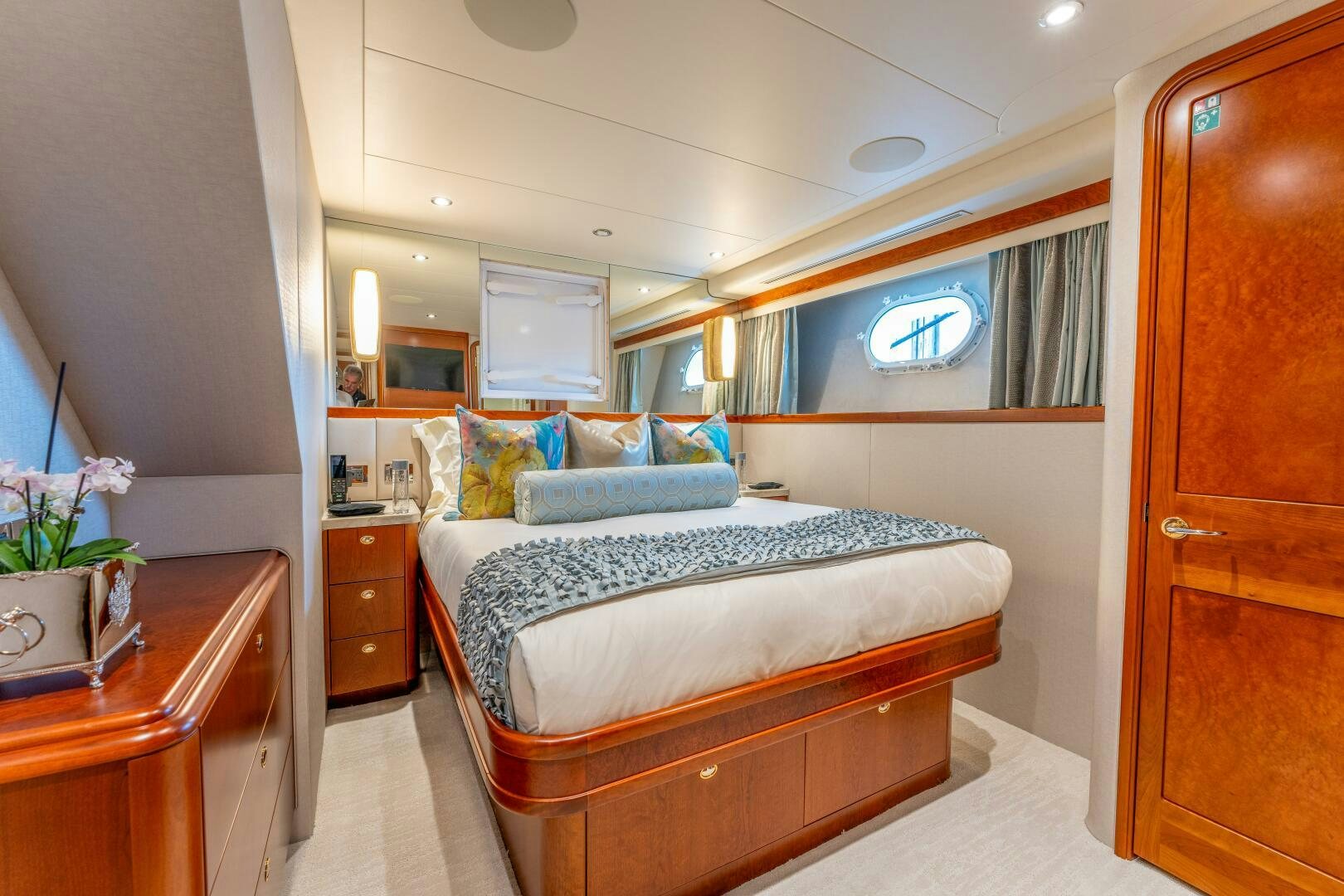 a bedroom with a bed and a desk aboard RELENTLESS Yacht for Sale