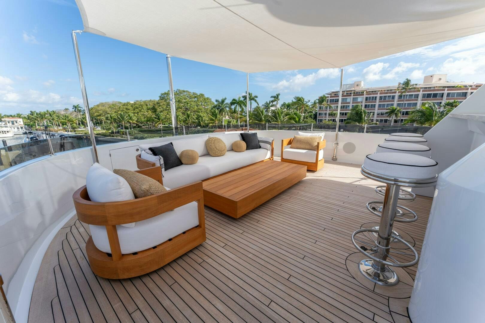 a room with a couch and a table and chairs aboard RELENTLESS Yacht for Sale