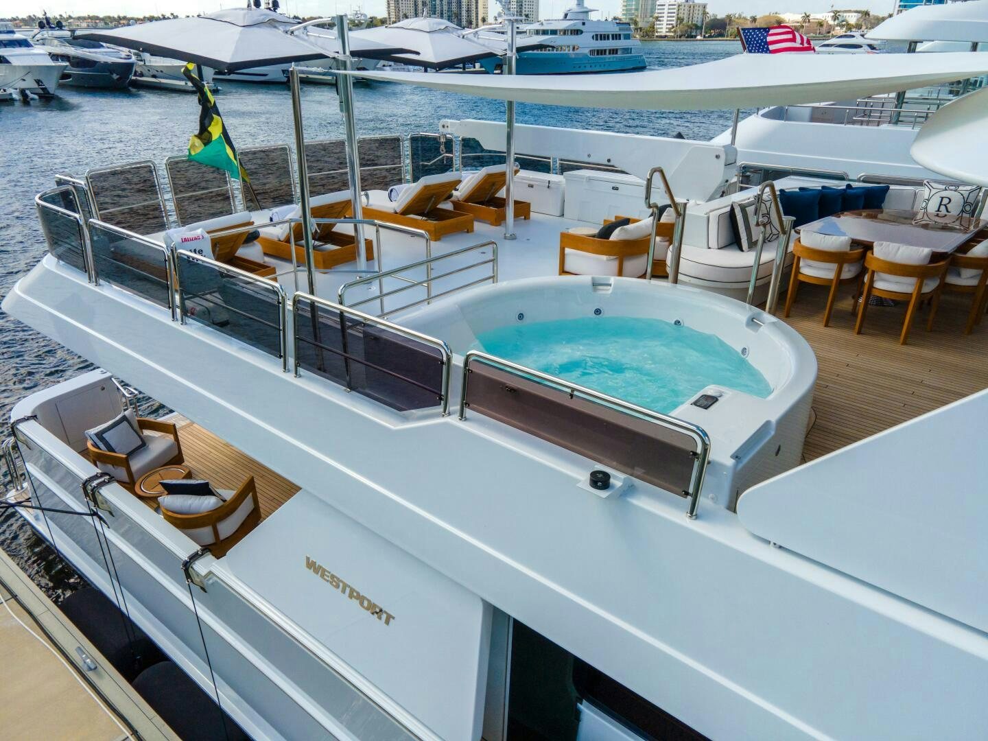 a boat with a flag on the deck aboard RELENTLESS Yacht for Sale