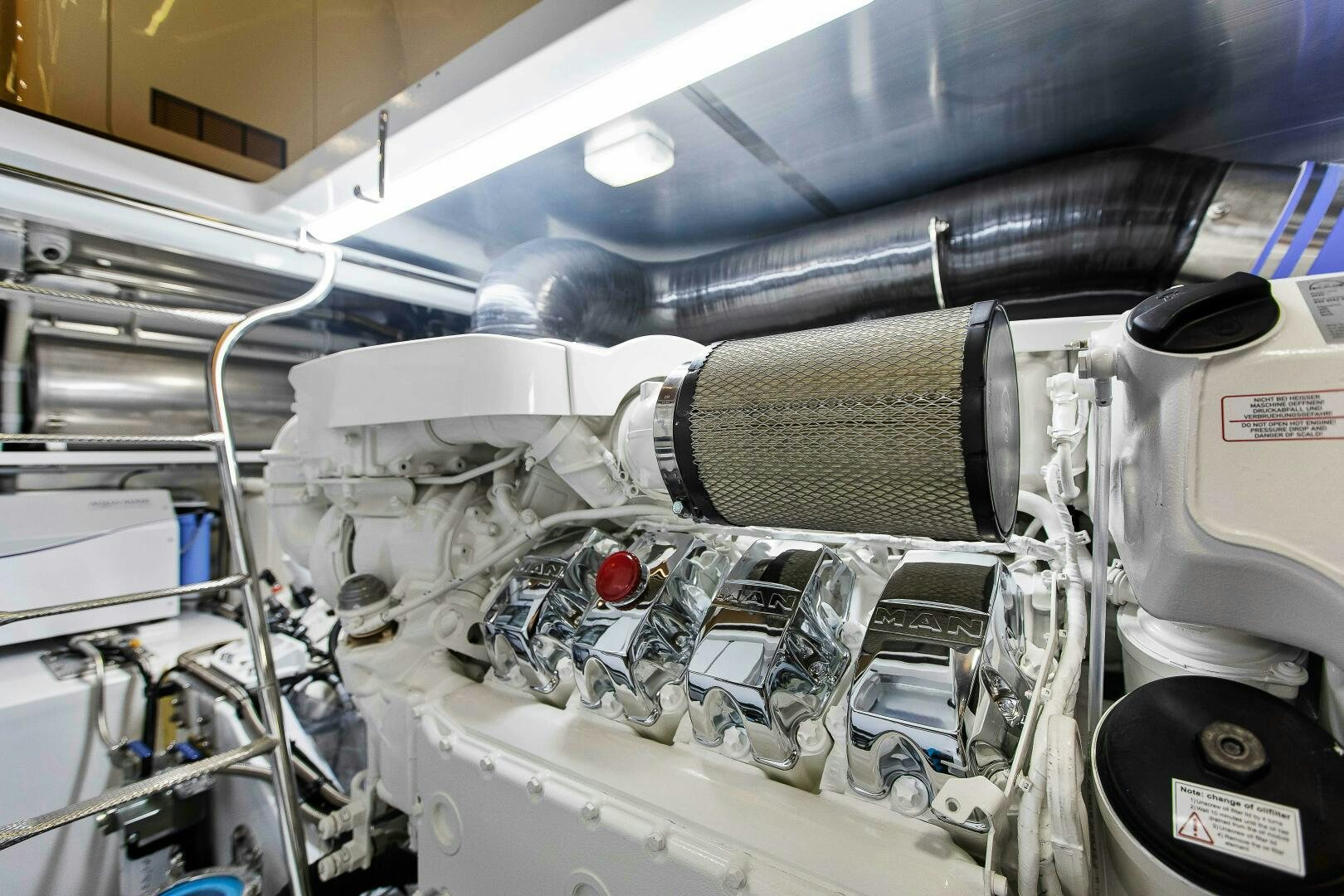 a car engine with a hood aboard THE KEYS Yacht for Sale