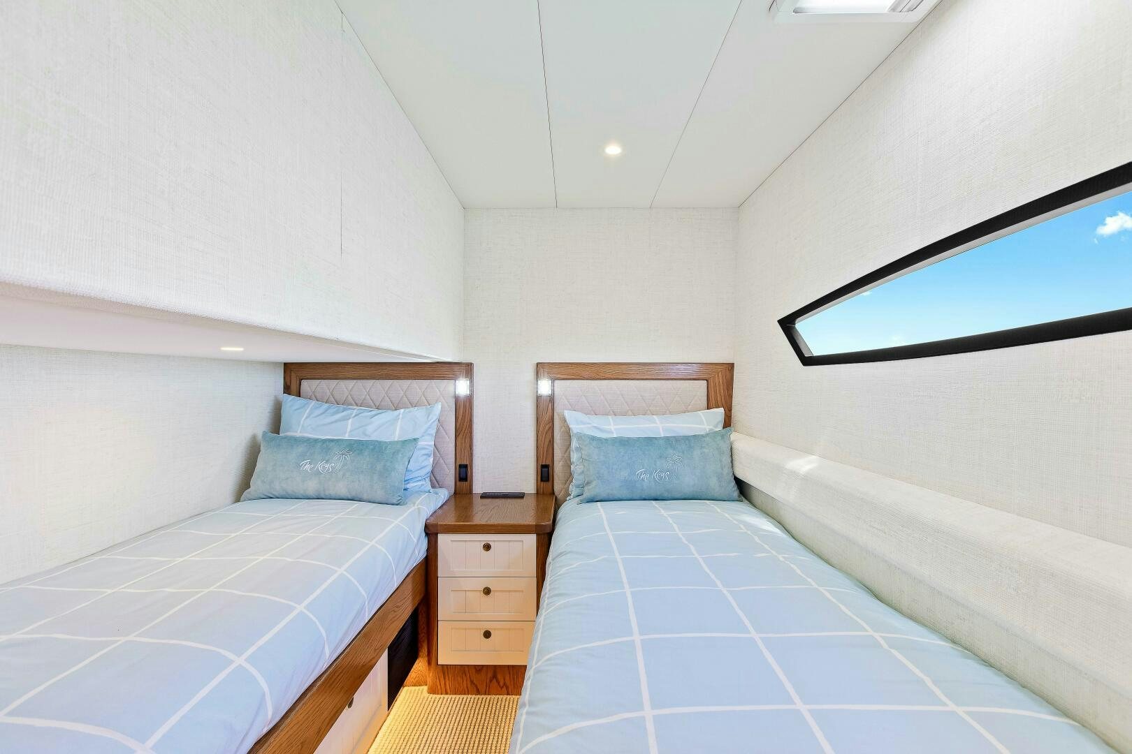 a room with two beds aboard THE KEYS Yacht for Sale