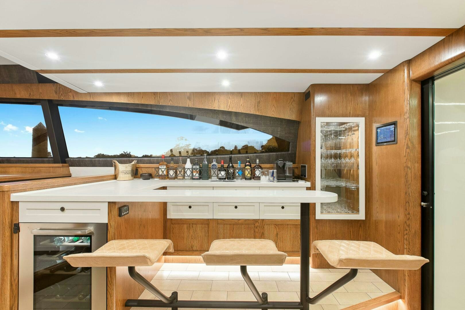 a bar with a bar and a table in front of it aboard THE KEYS Yacht for Sale