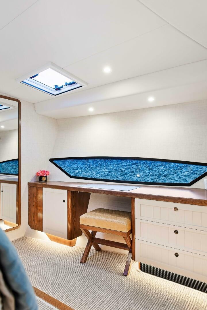 a desk with a blue pillow on it aboard THE KEYS Yacht for Sale