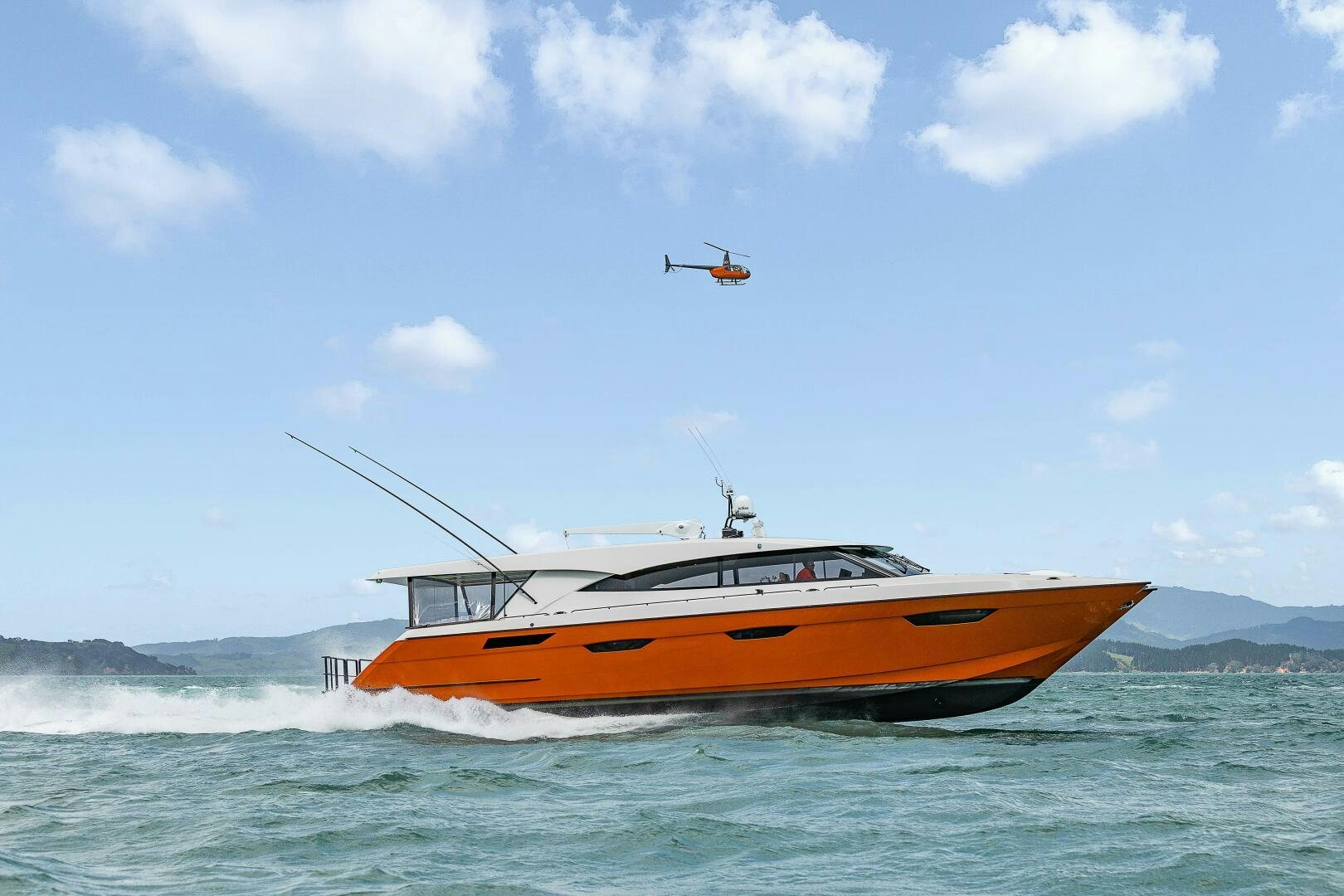 a helicopter flying over a boat in the ocean aboard THE KEYS Yacht for Sale