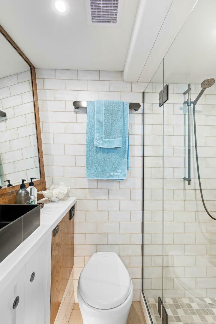 a bathroom with a shower and a toilet aboard THE KEYS Yacht for Sale