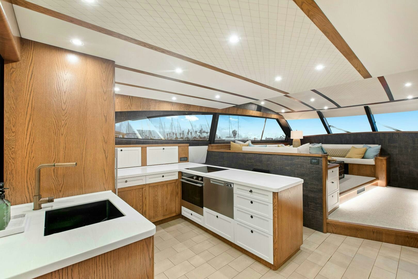 a kitchen with wooden cabinets aboard THE KEYS Yacht for Sale