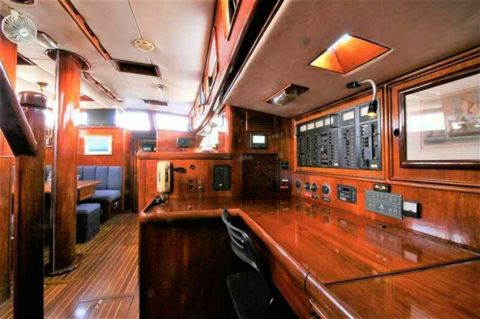 a bar with wood floors aboard KOKOMO VI Yacht for Sale