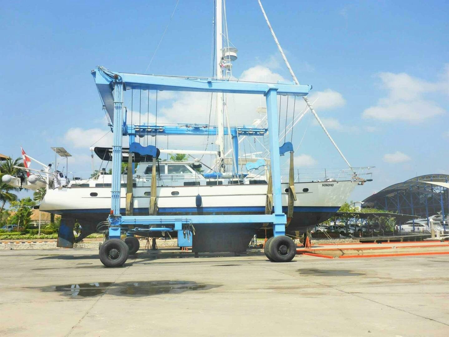 a large boat on a trailer aboard KOKOMO VI Yacht for Sale