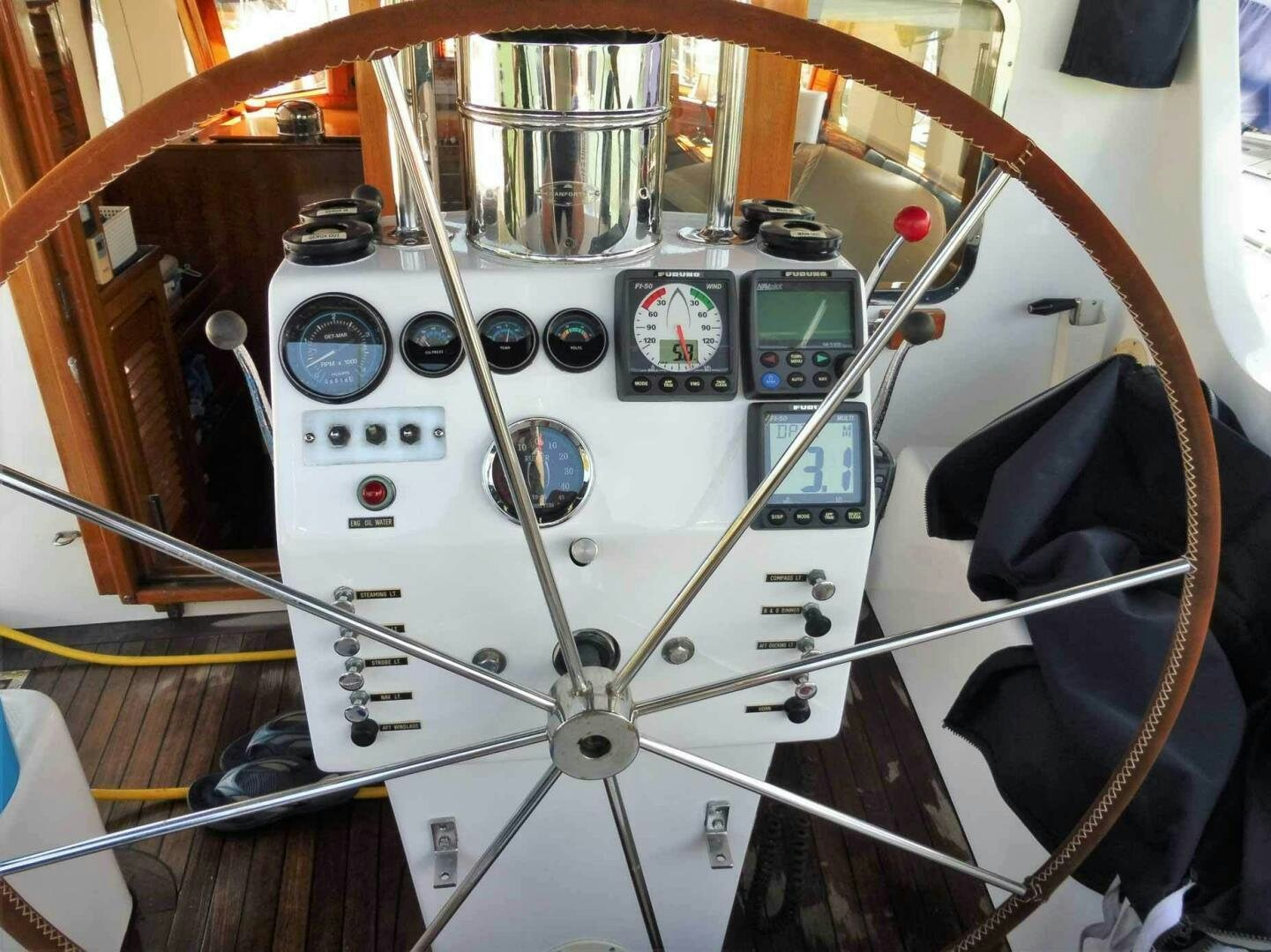 a white machine with a dial aboard KOKOMO VI Yacht for Sale