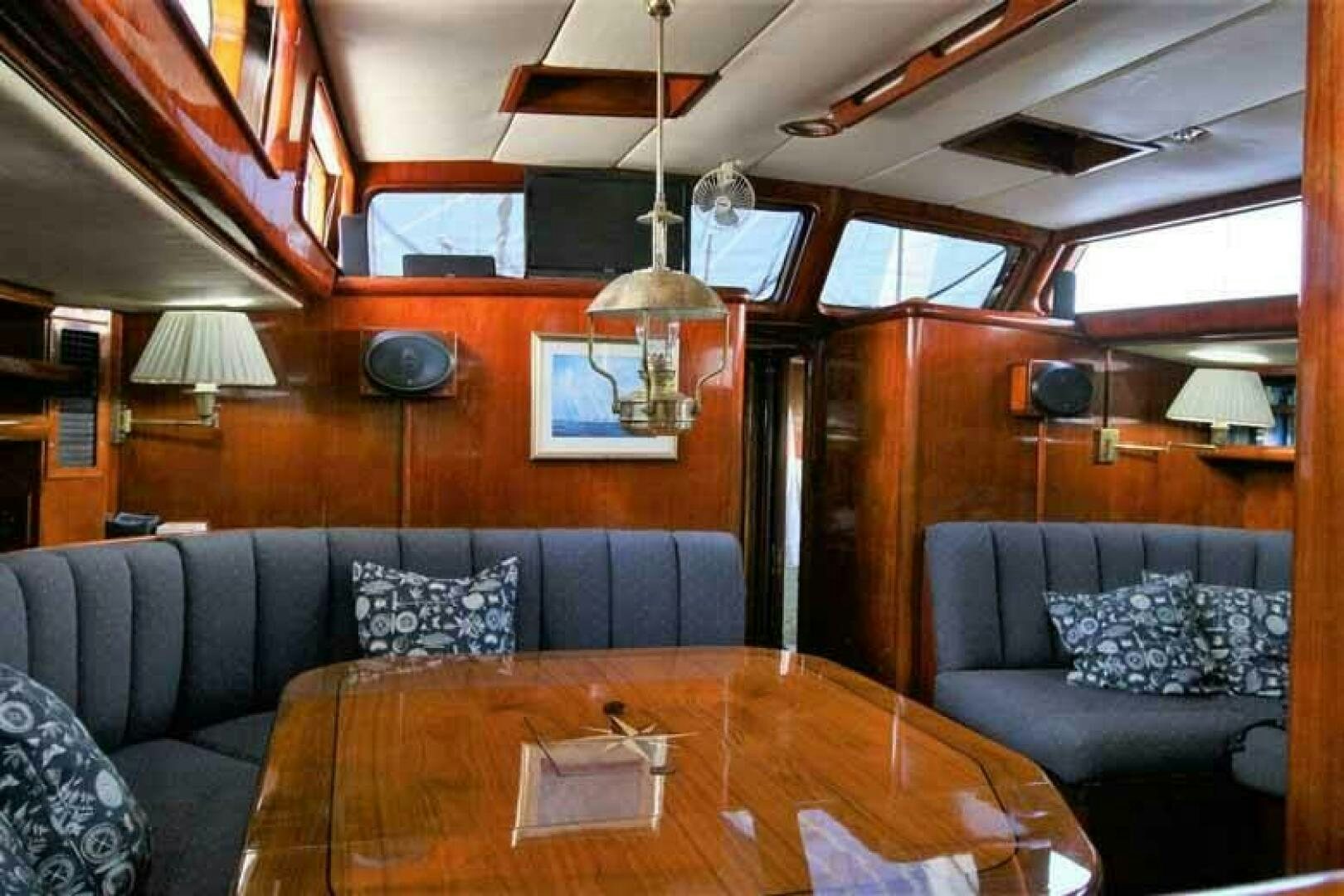 a living room with a couch and a table aboard KOKOMO VI Yacht for Sale