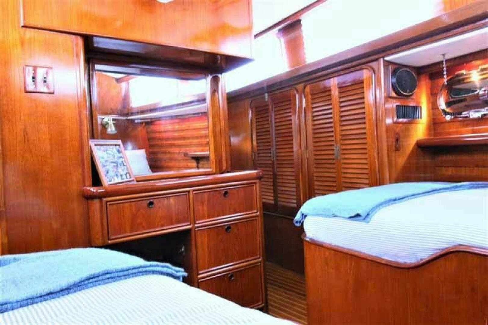a room with bunk beds aboard KOKOMO VI Yacht for Sale