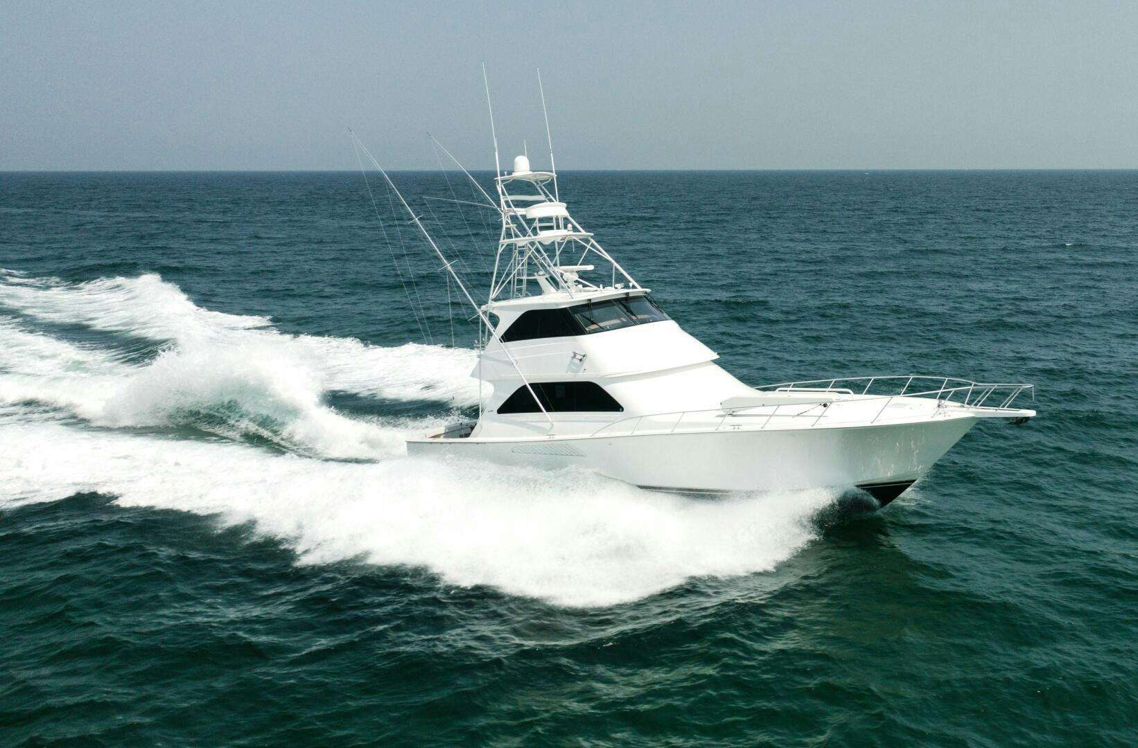 a white boat in the ocean aboard BAREFOOT DRIVE Yacht for Sale