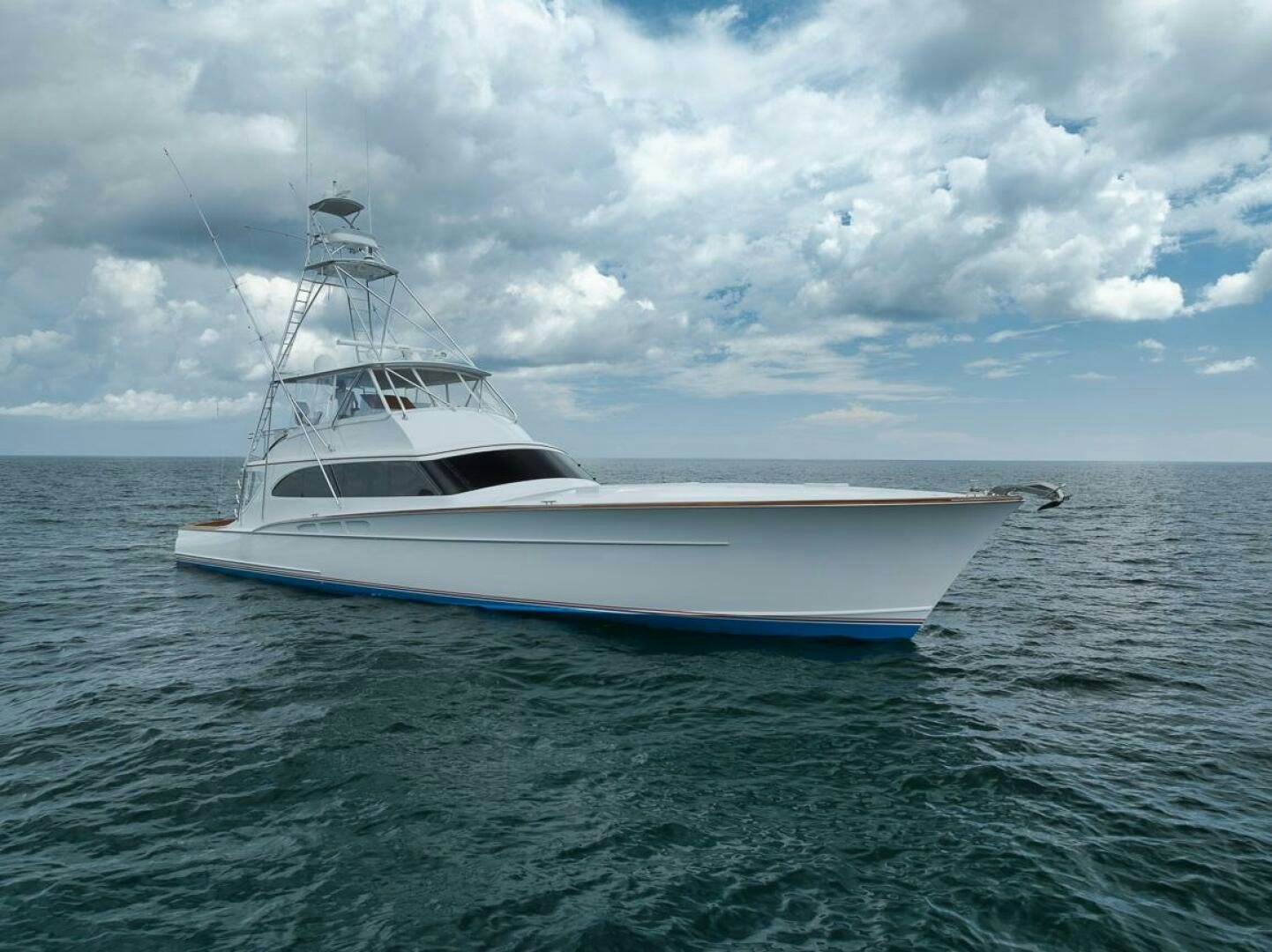 a white boat in the water aboard PERSISTENCE Yacht for Sale