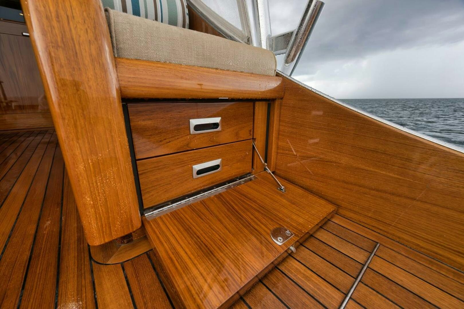 a wooden boat on a deck aboard PERSISTENCE Yacht for Sale