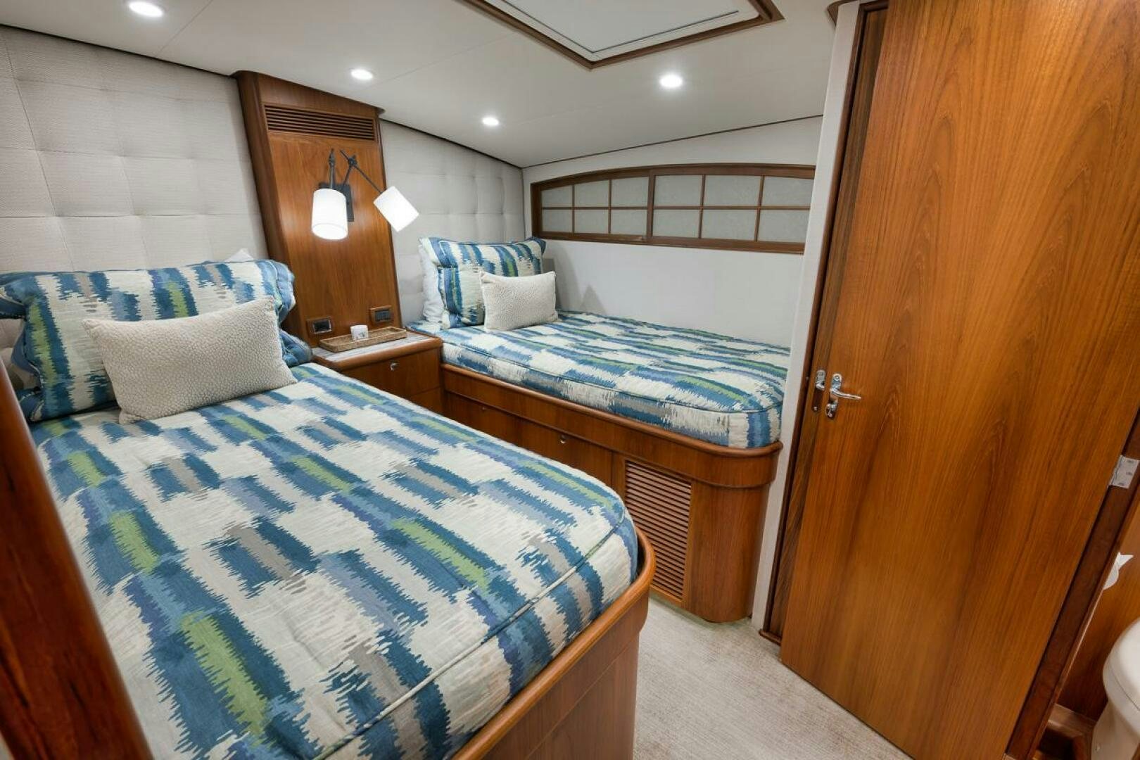 a room with two beds aboard PERSISTENCE Yacht for Sale