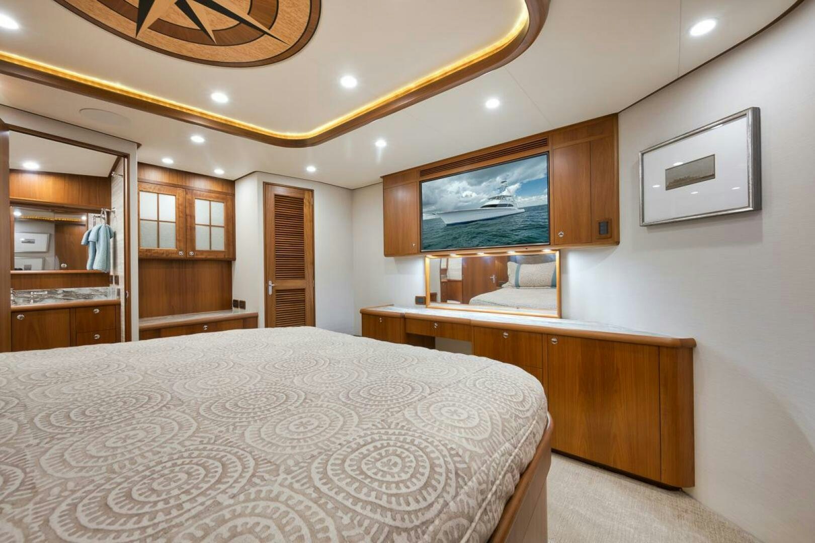 a bedroom with a large bed aboard PERSISTENCE Yacht for Sale