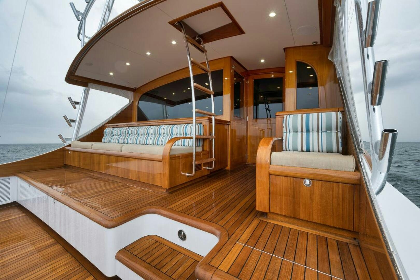 a room with a bed and a chair aboard PERSISTENCE Yacht for Sale