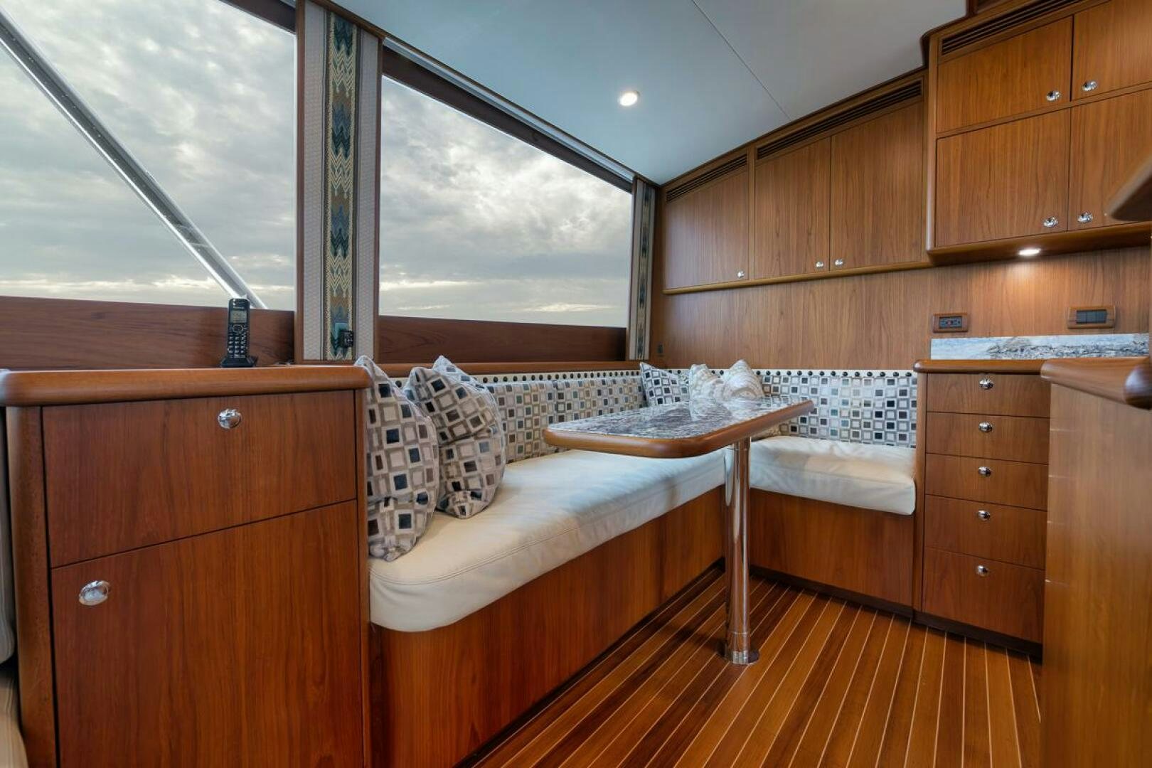 a room with a bed and a table aboard PERSISTENCE Yacht for Sale