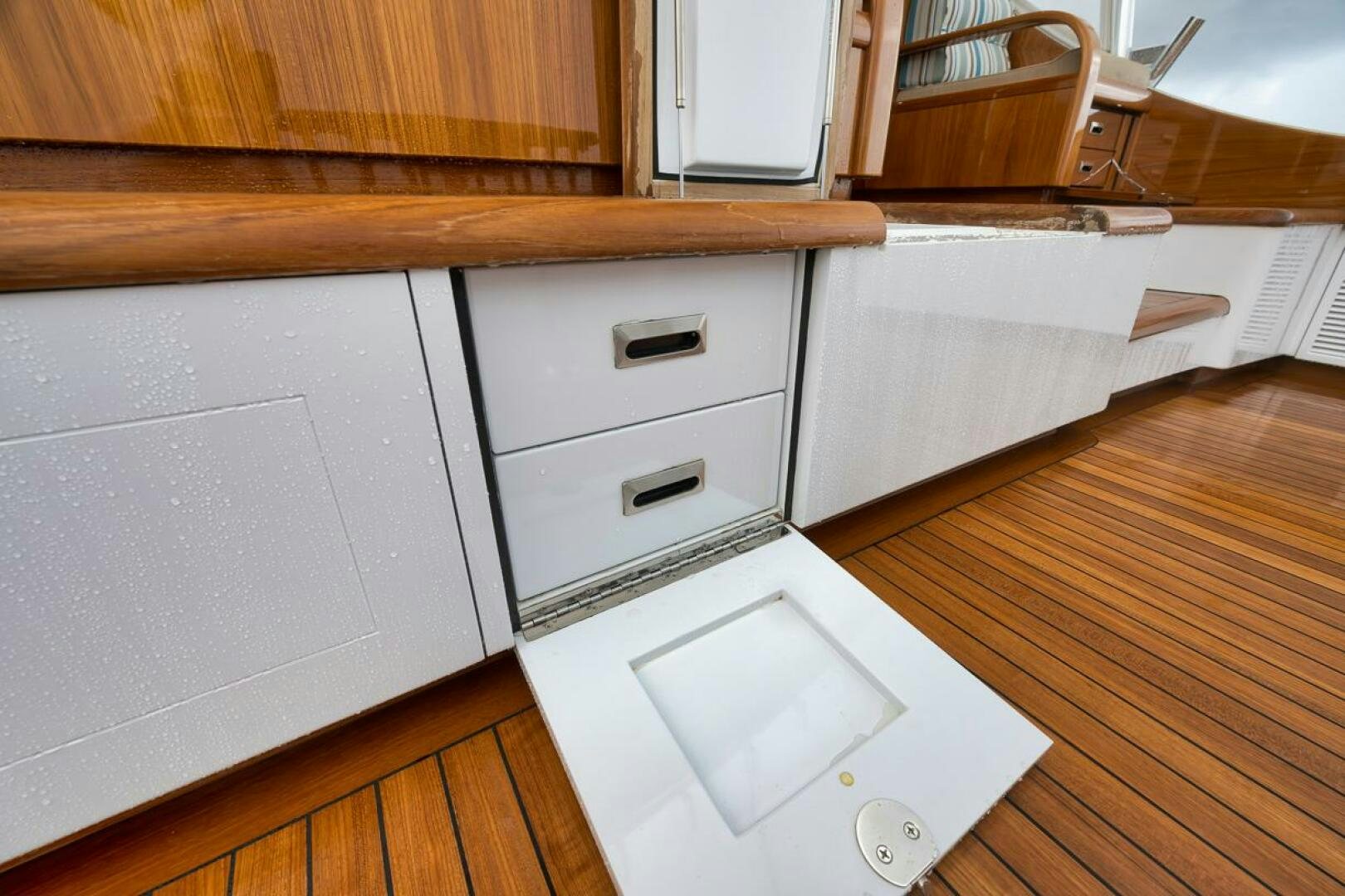 a kitchen with white cabinets aboard PERSISTENCE Yacht for Sale