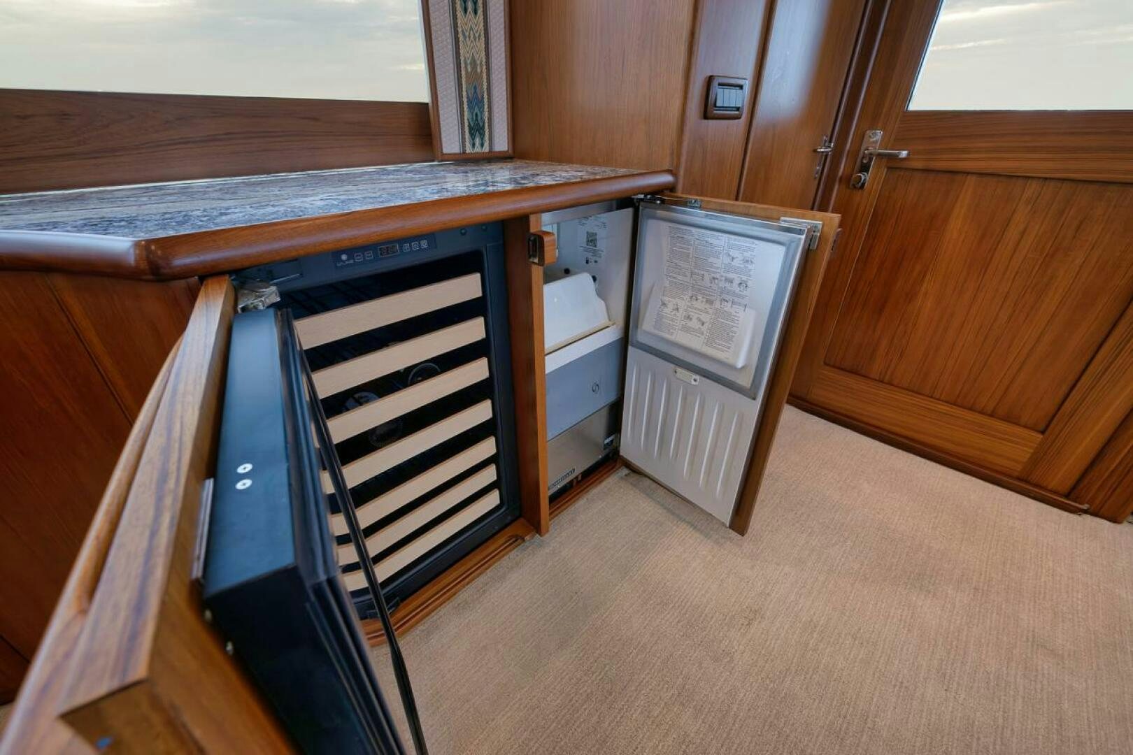 a room with a cabinet and a vent aboard PERSISTENCE Yacht for Sale