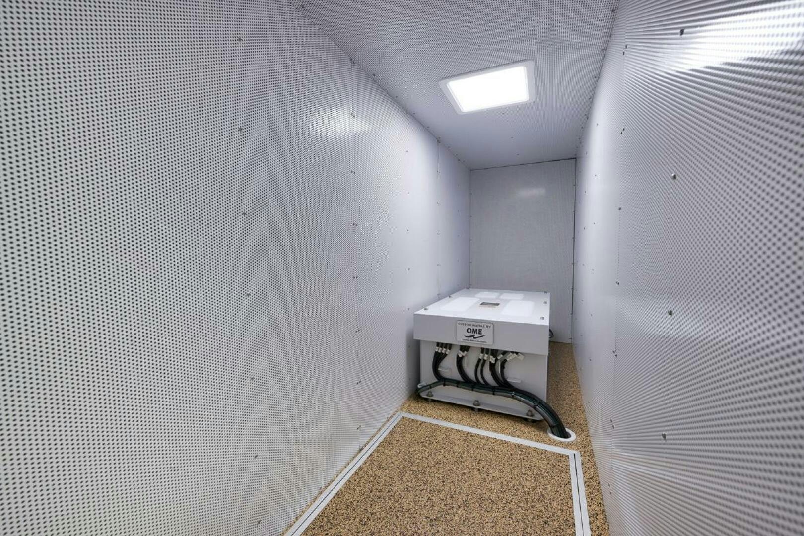 a white machine in a room aboard PERSISTENCE Yacht for Sale