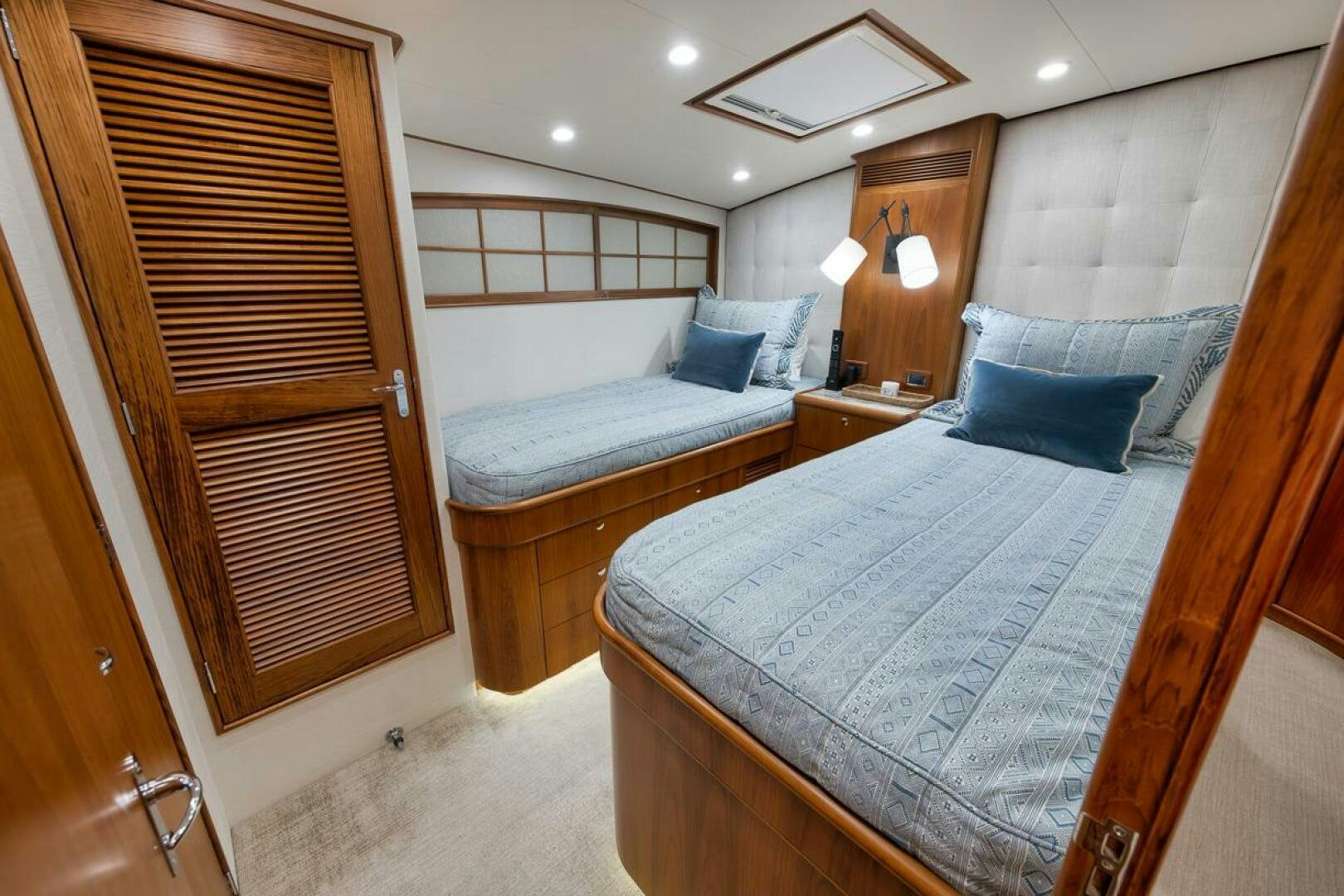 a room with a bed and a couch aboard PERSISTENCE Yacht for Sale