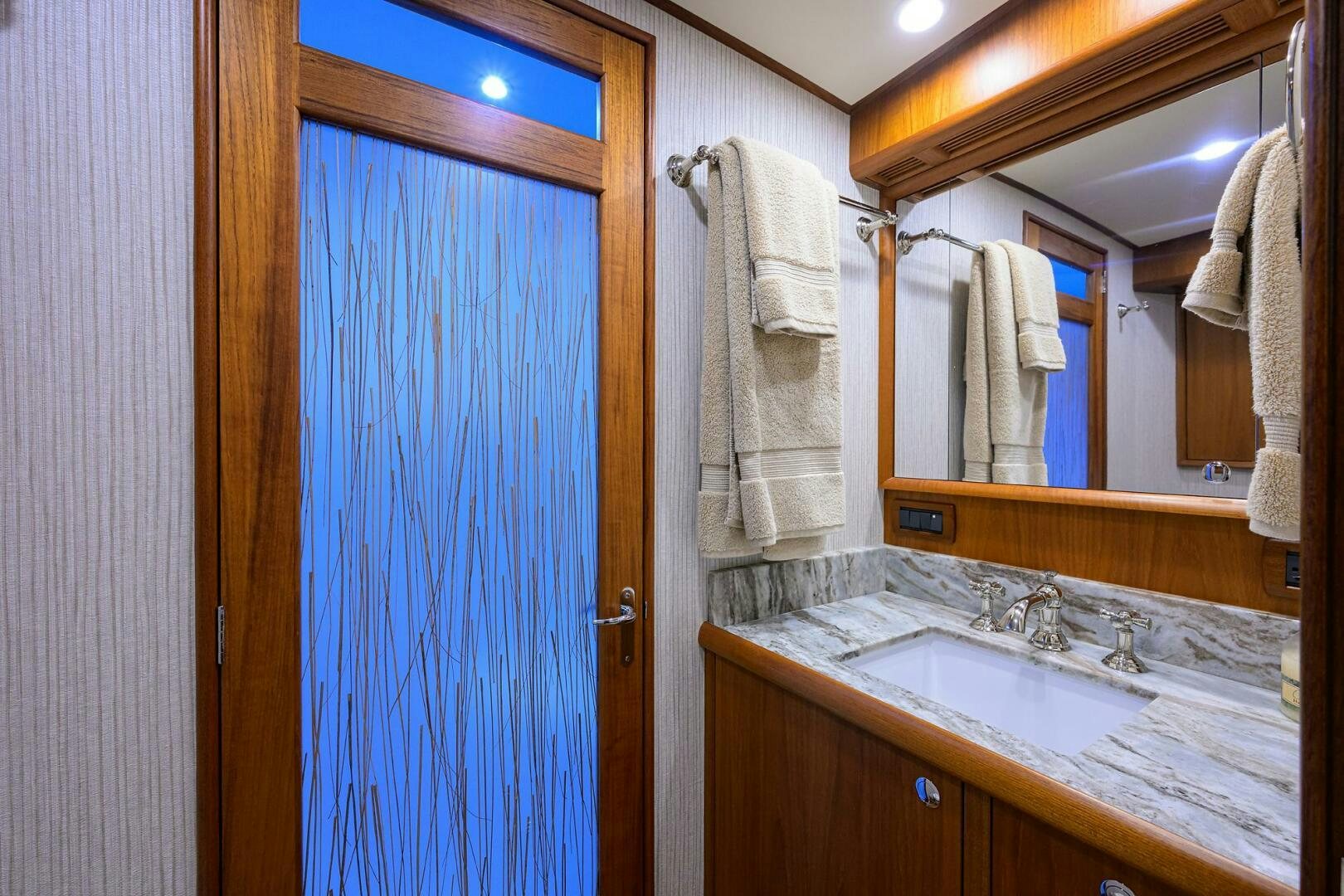 a bathroom with a sink and a mirror aboard PERSISTENCE Yacht for Sale