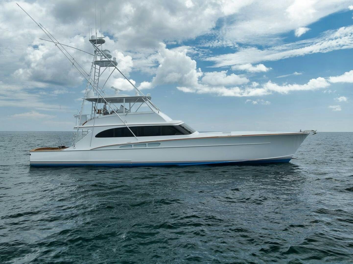 a white boat on the water aboard PERSISTENCE Yacht for Sale