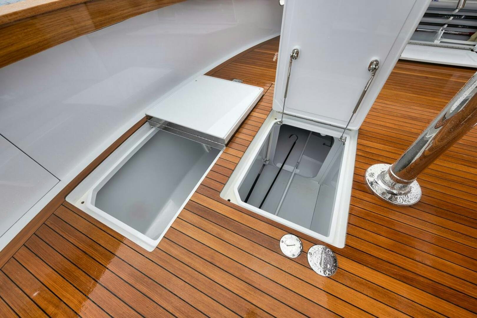 a white cabinet on a wooden floor aboard PERSISTENCE Yacht for Sale