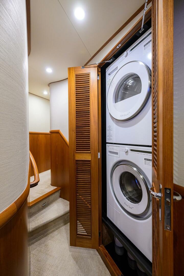 a washer and dryer in a room aboard PERSISTENCE Yacht for Sale