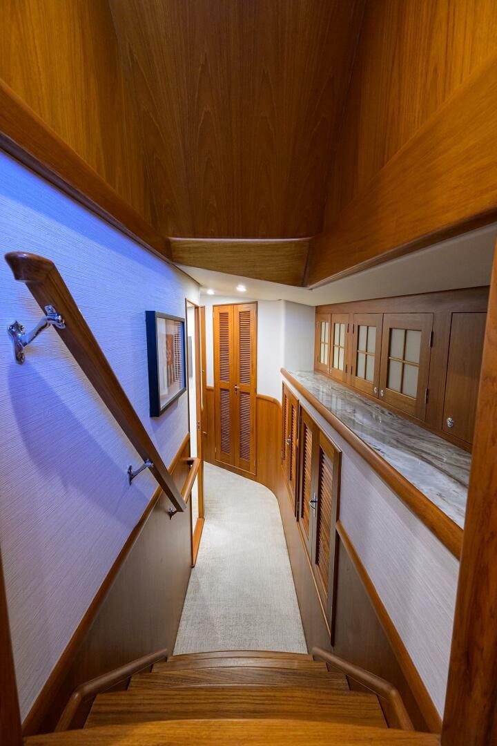 a wooden staircase in a house aboard PERSISTENCE Yacht for Sale