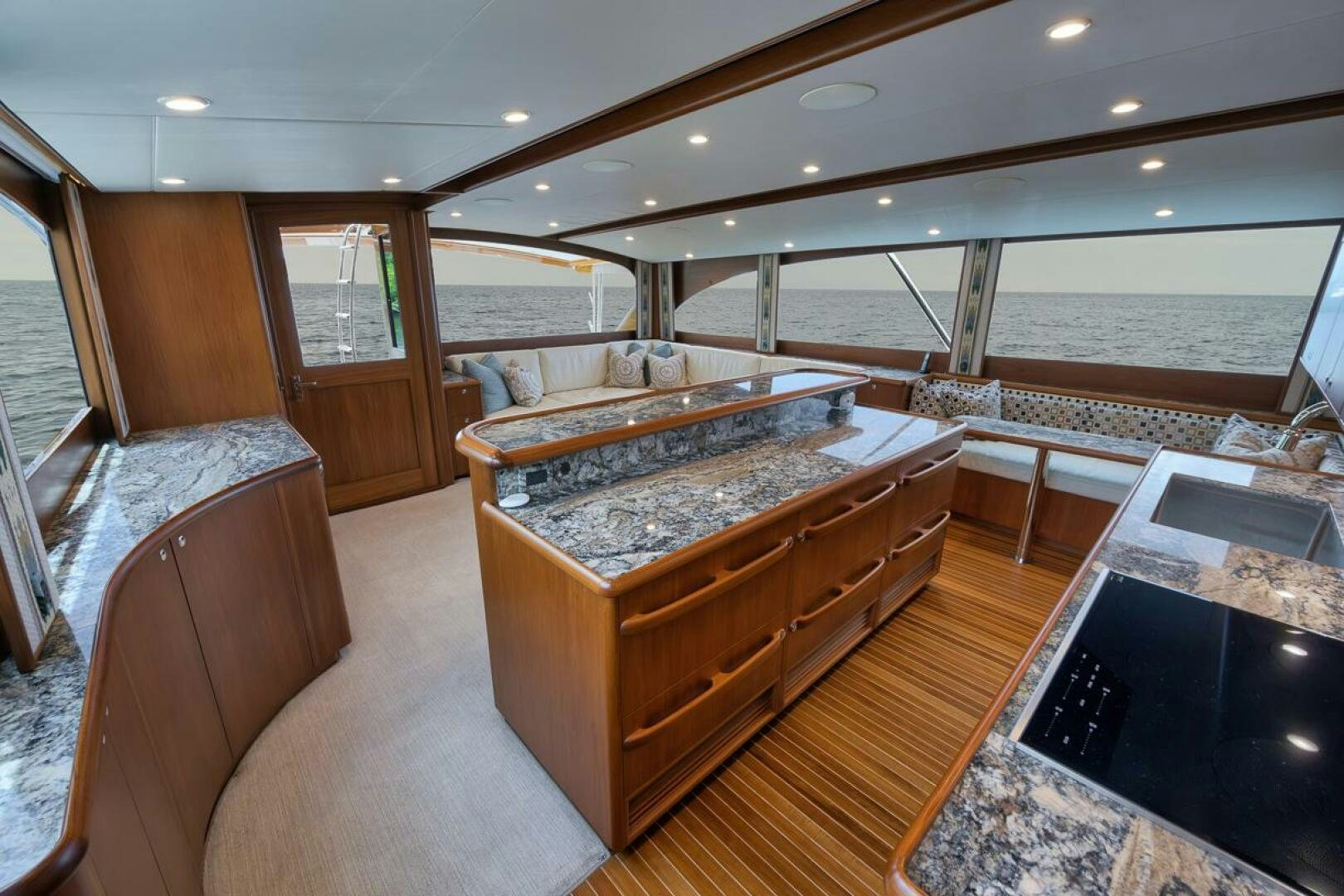 a large room with a large pool aboard PERSISTENCE Yacht for Sale