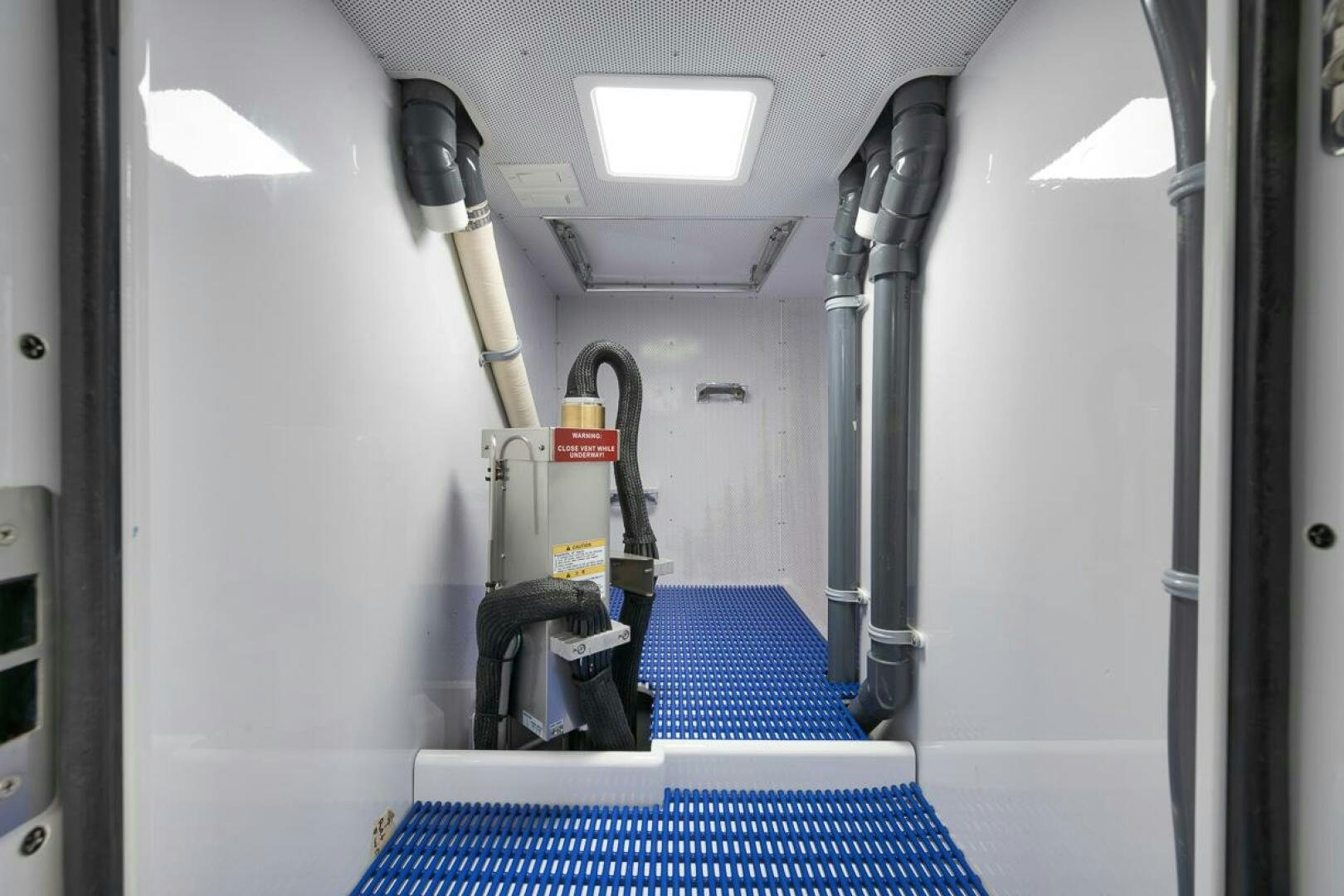 a machine on the floor aboard PERSISTENCE Yacht for Sale