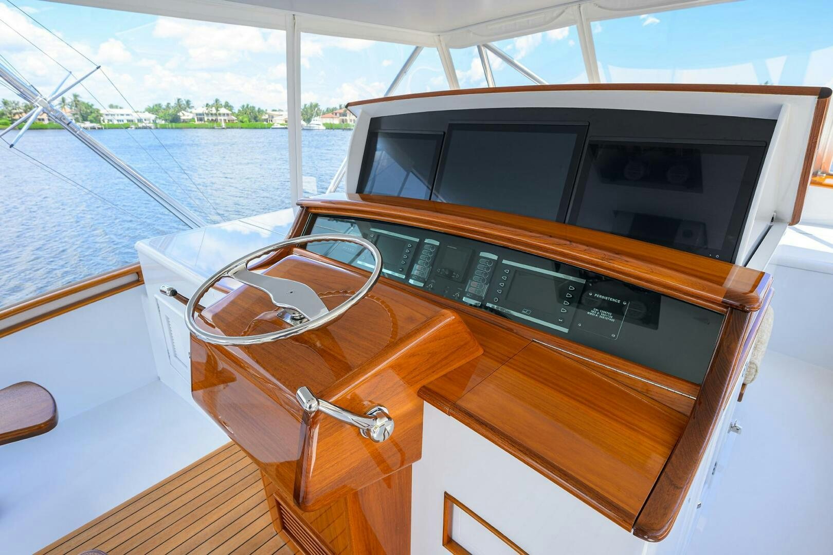 a wooden chest with a chair and a wood table on it aboard PERSISTENCE Yacht for Sale