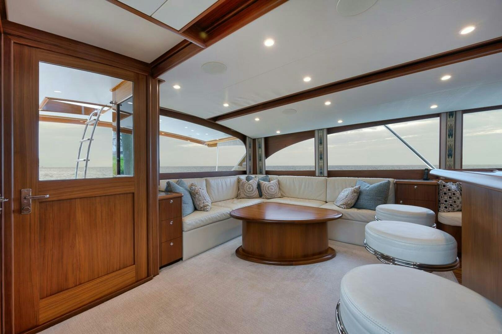 a living room with a large wood cabinet aboard PERSISTENCE Yacht for Sale