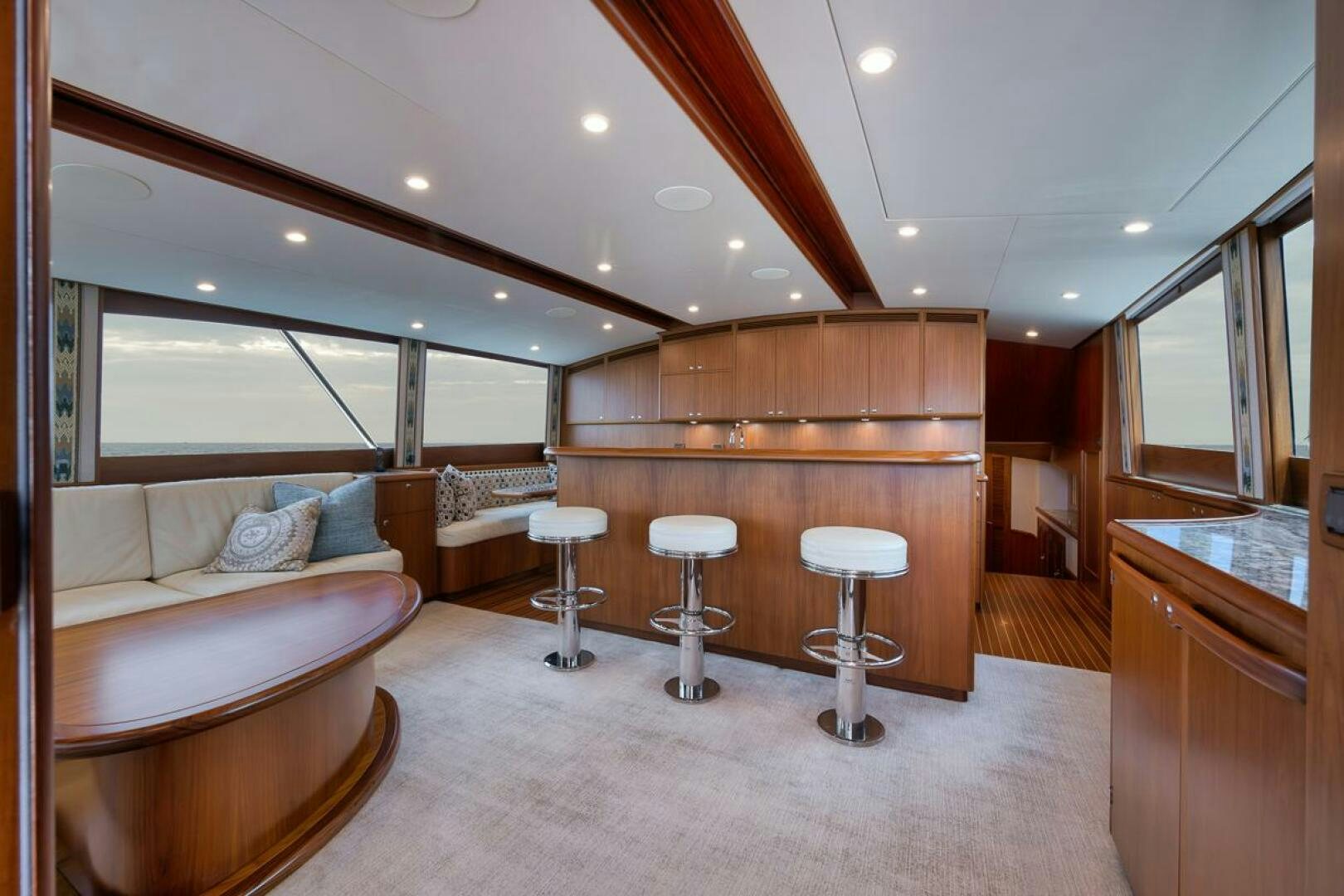 a living room with a couch and a table aboard PERSISTENCE Yacht for Sale