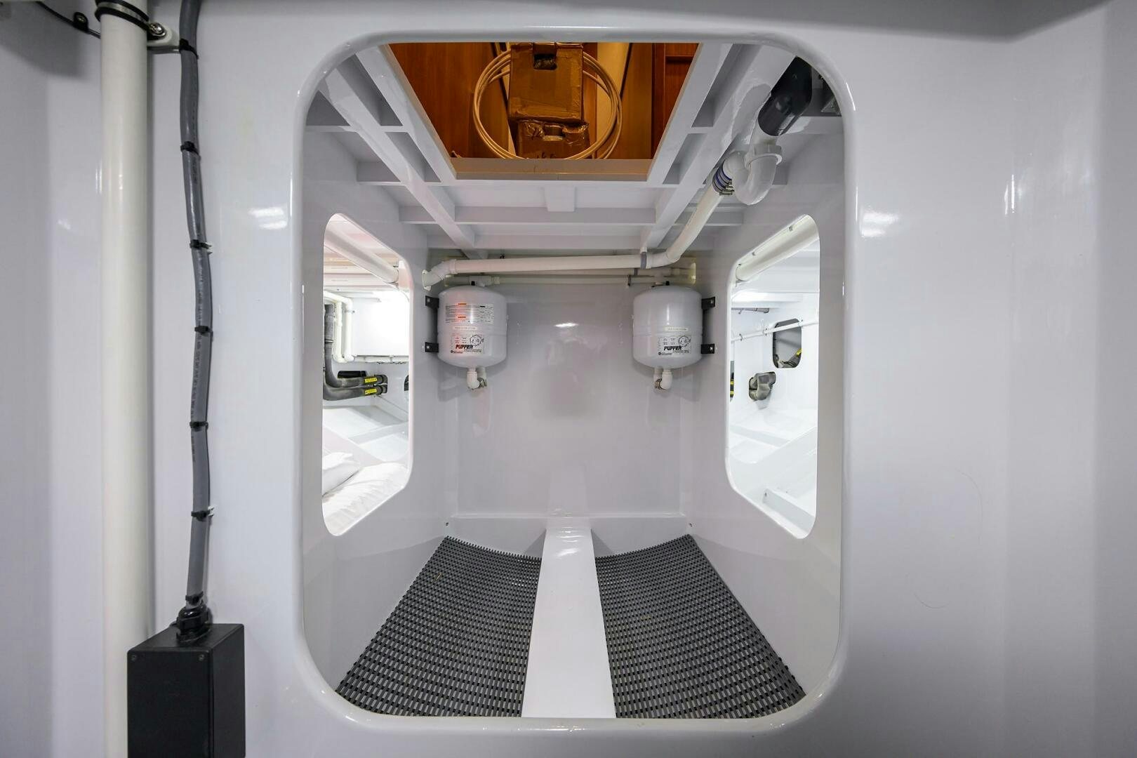 a bathroom with a black rug aboard PERSISTENCE Yacht for Sale