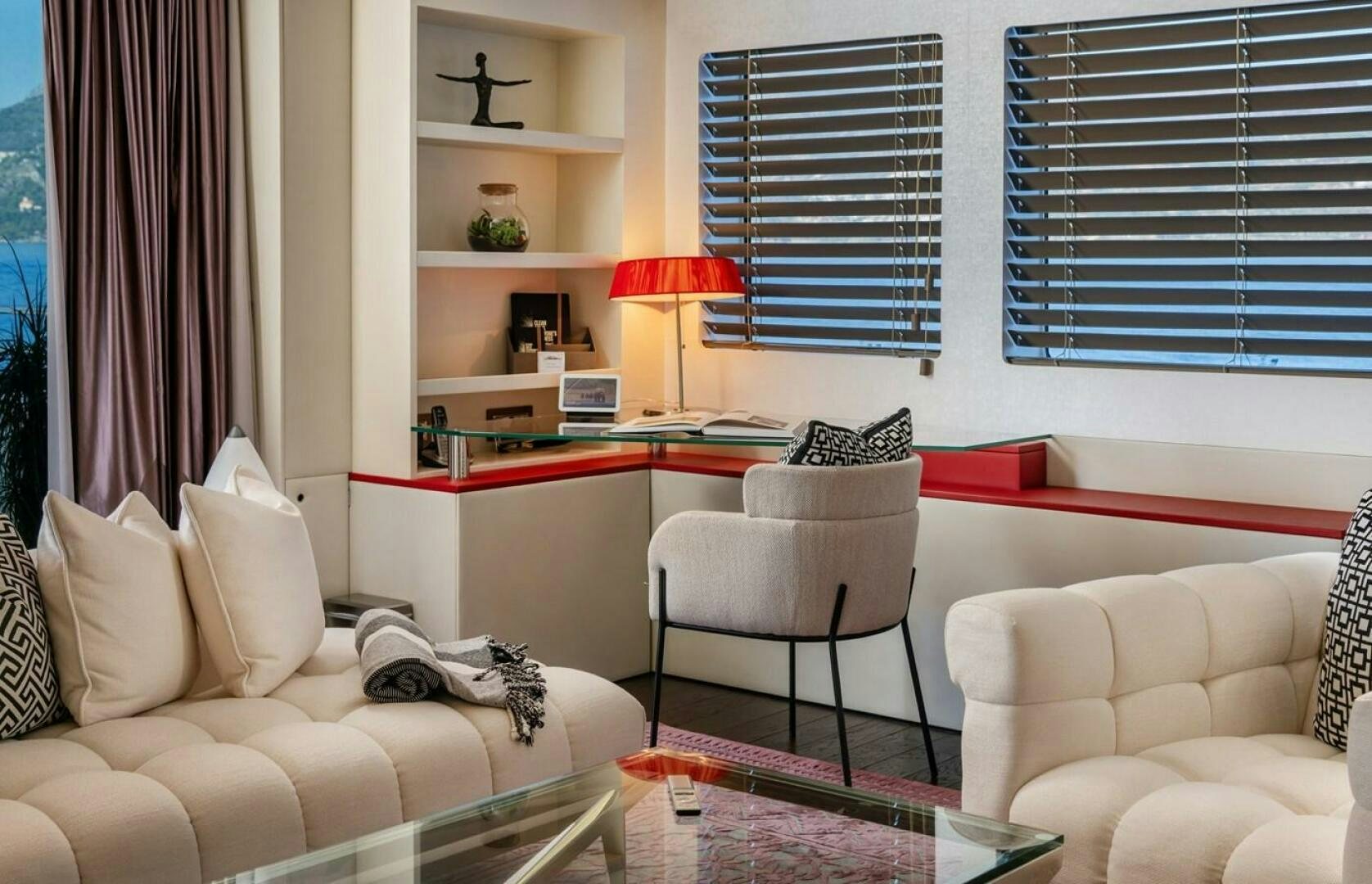 a living room with white furniture aboard JOY ME Yacht for Sale