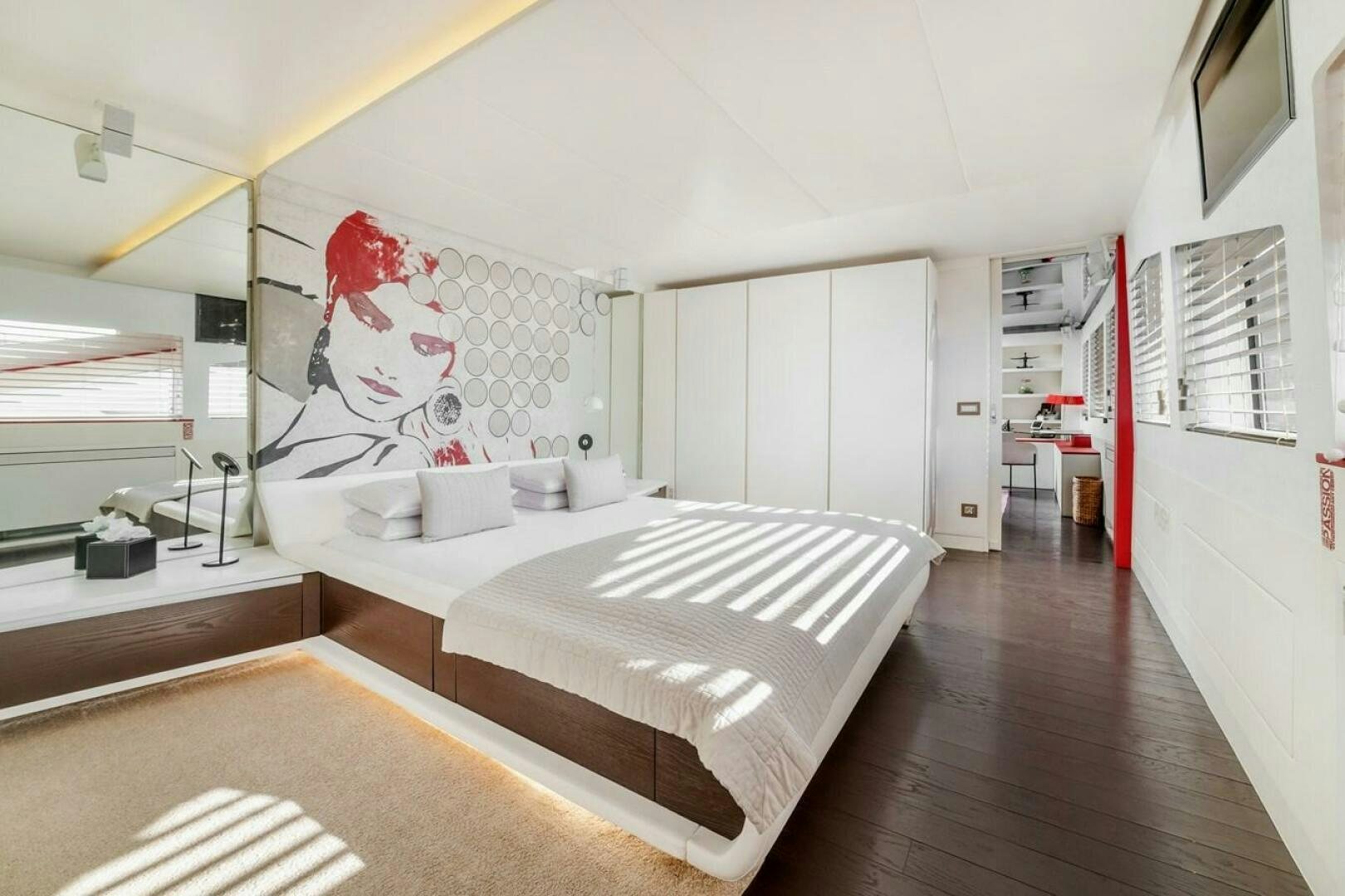 a large white bed in a room aboard JOY ME Yacht for Sale
