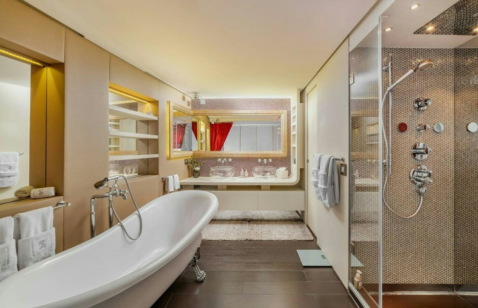 a bathroom with a tub and shower aboard JOY ME Yacht for Sale