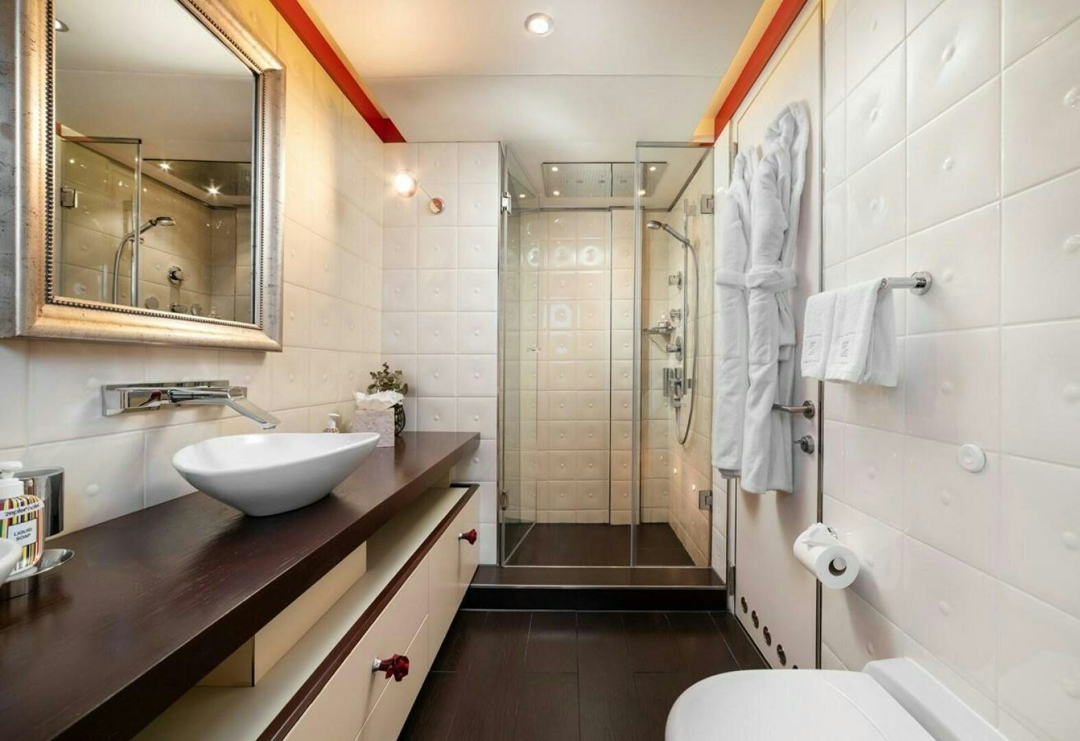 a bathroom with a sink and a mirror aboard JOY ME Yacht for Sale