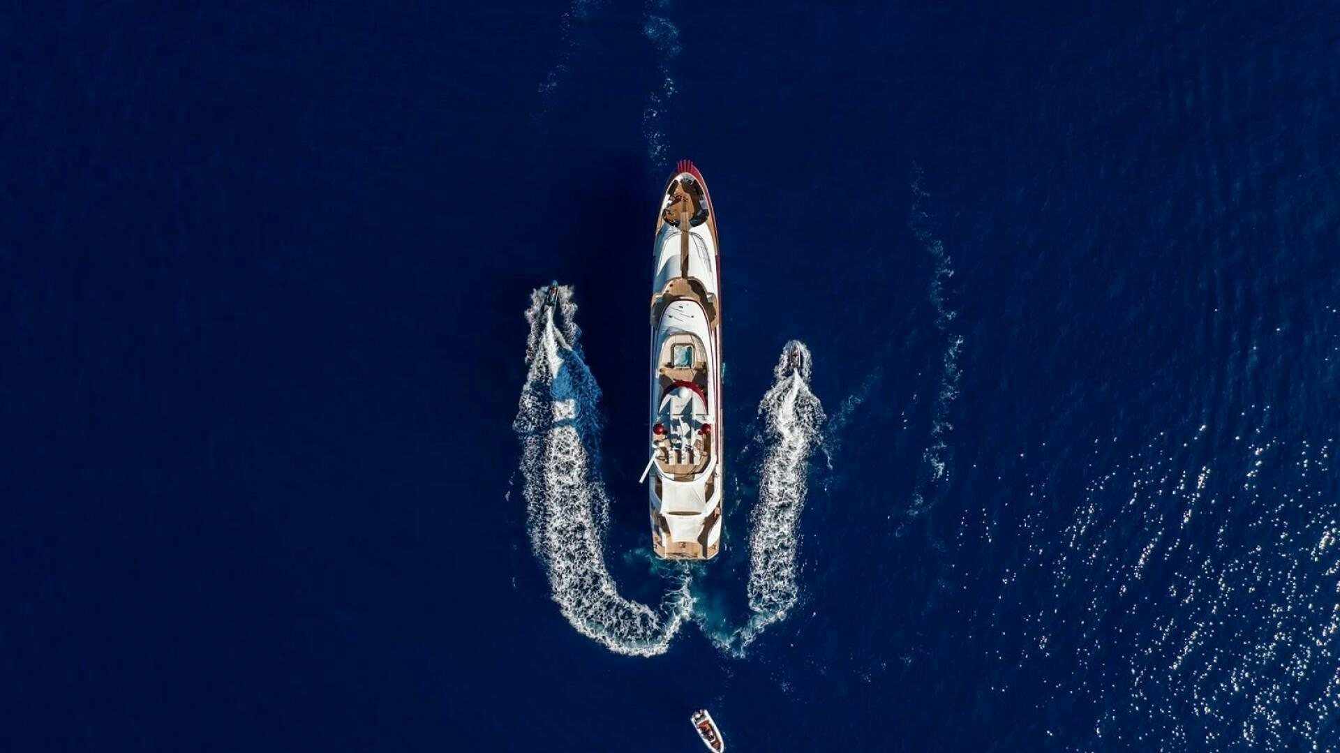 a white and red boat aboard JOY ME Yacht for Sale