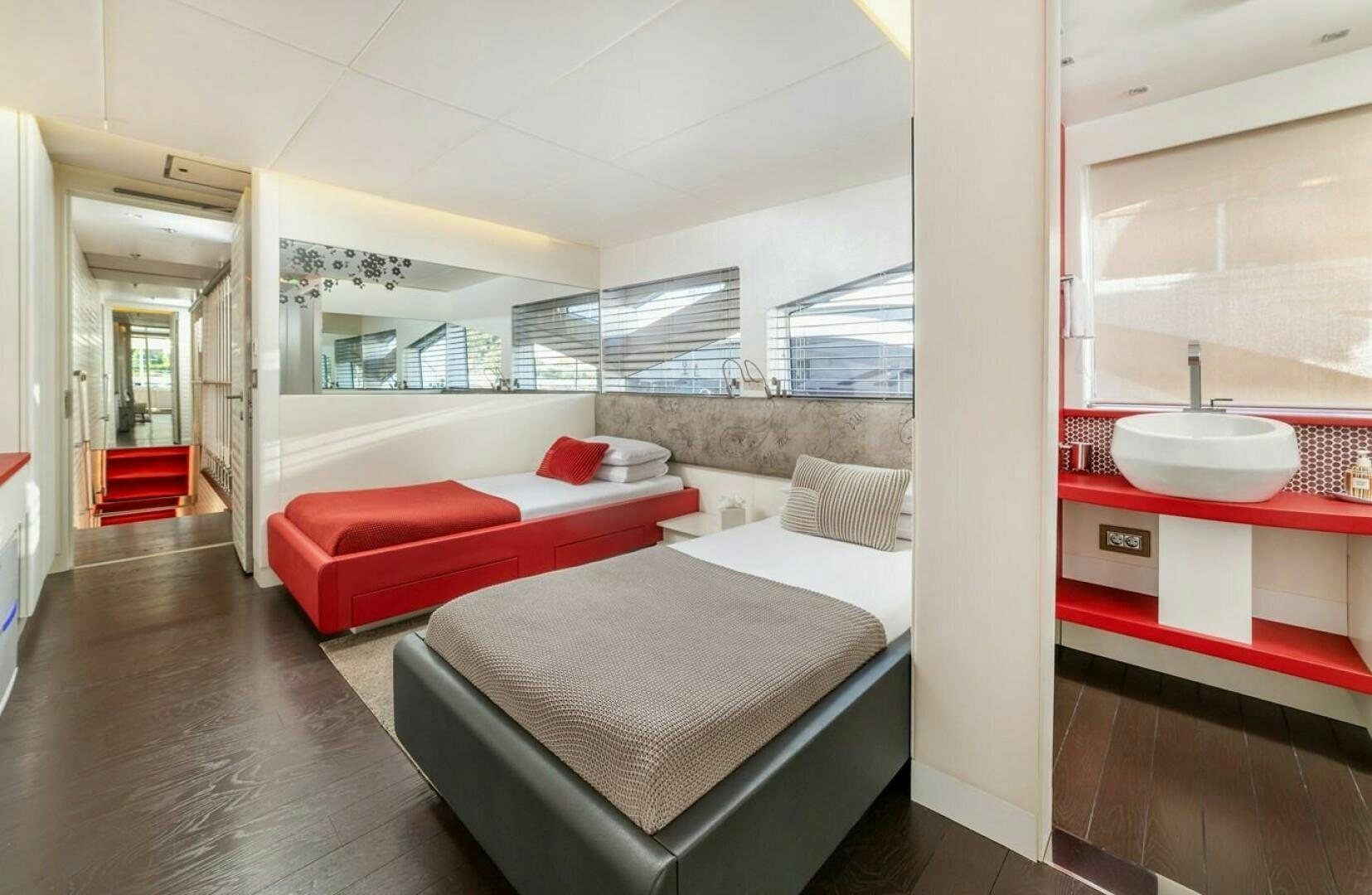 a room with a bed and a desk aboard JOY ME Yacht for Sale