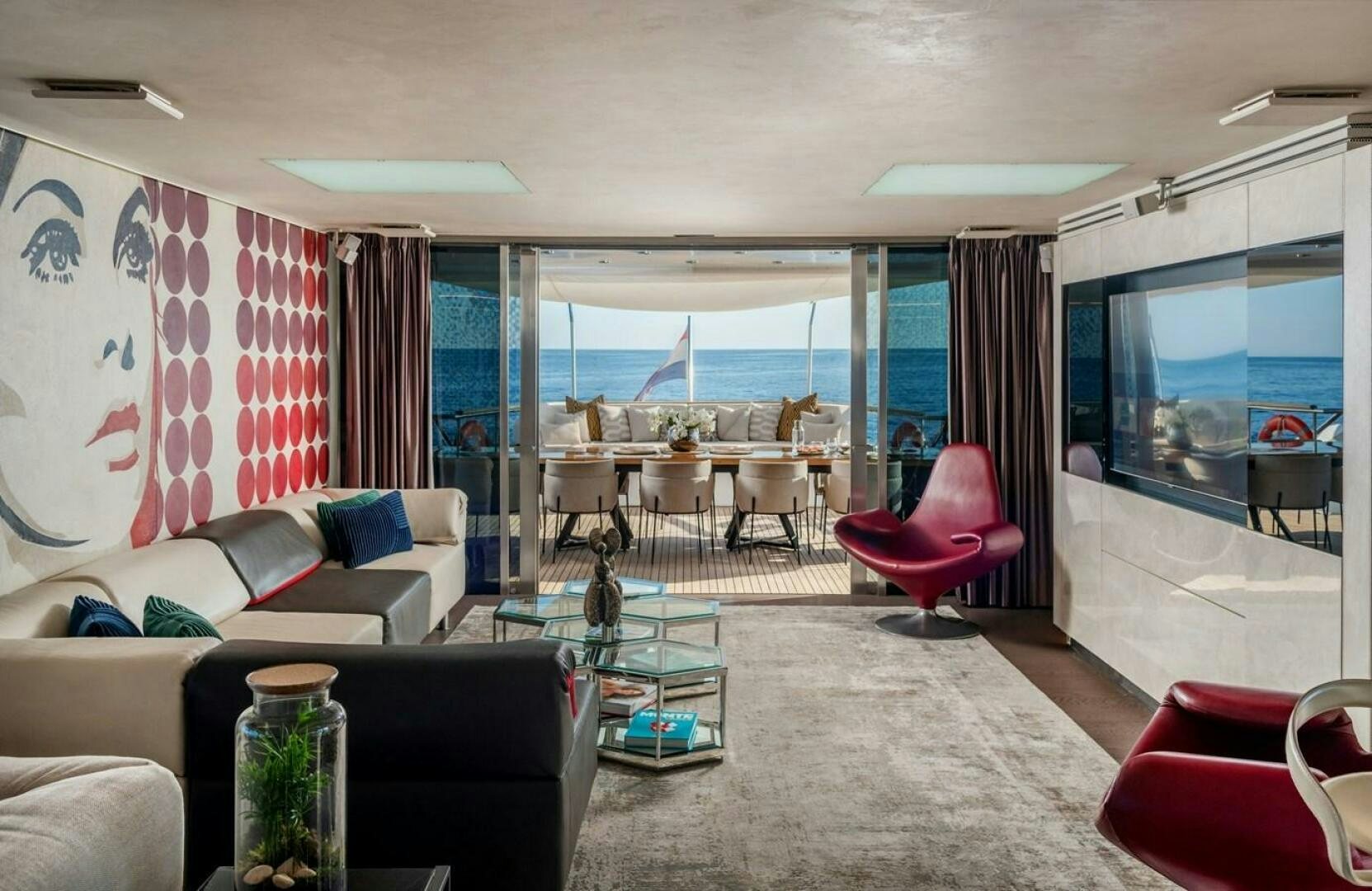 a living room with a large window aboard JOY ME Yacht for Sale