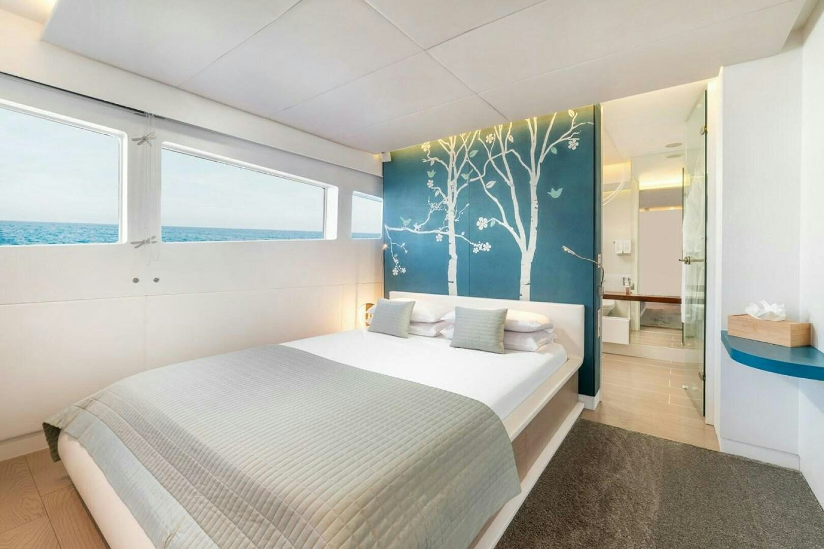 a bedroom with a large bed aboard JOY ME Yacht for Sale
